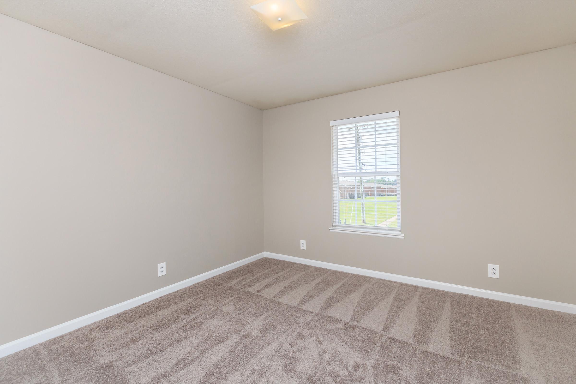 a view of a bedroom next to a window