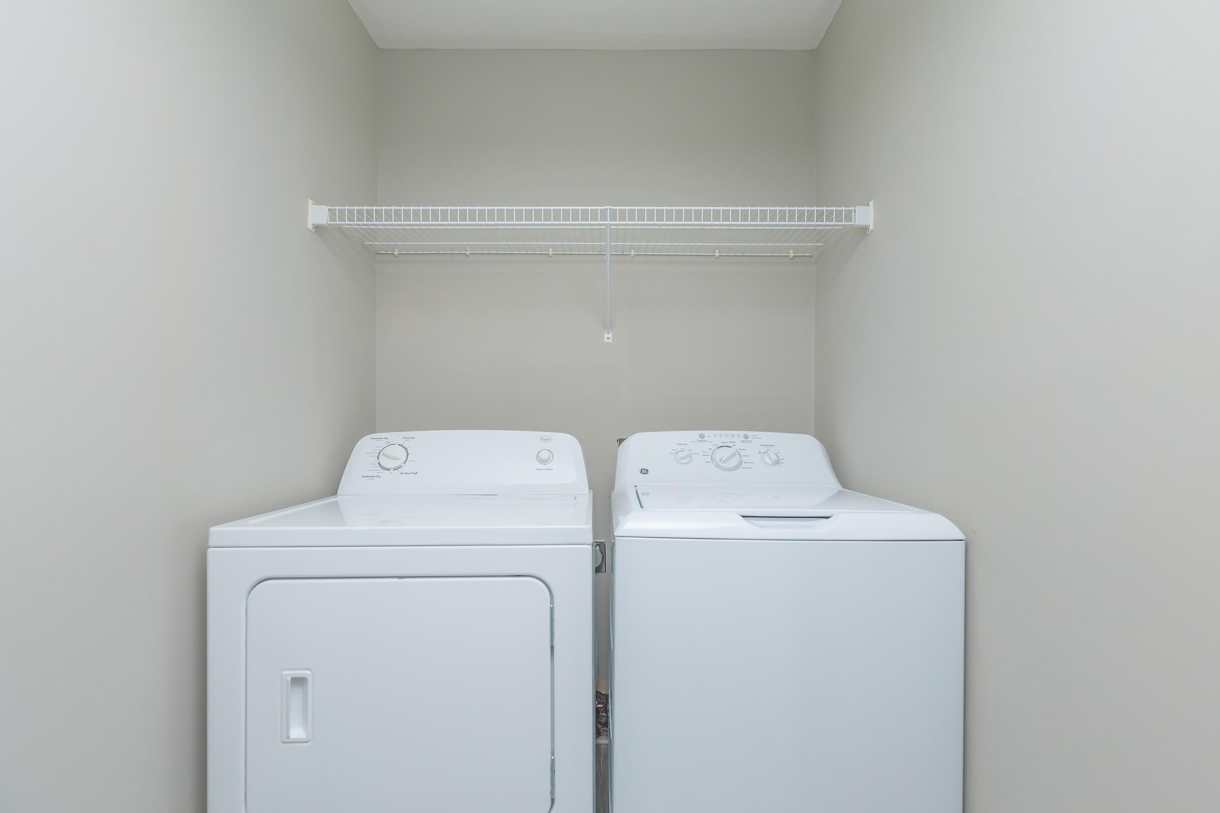 a refrigerator freezer sitting next to a sink