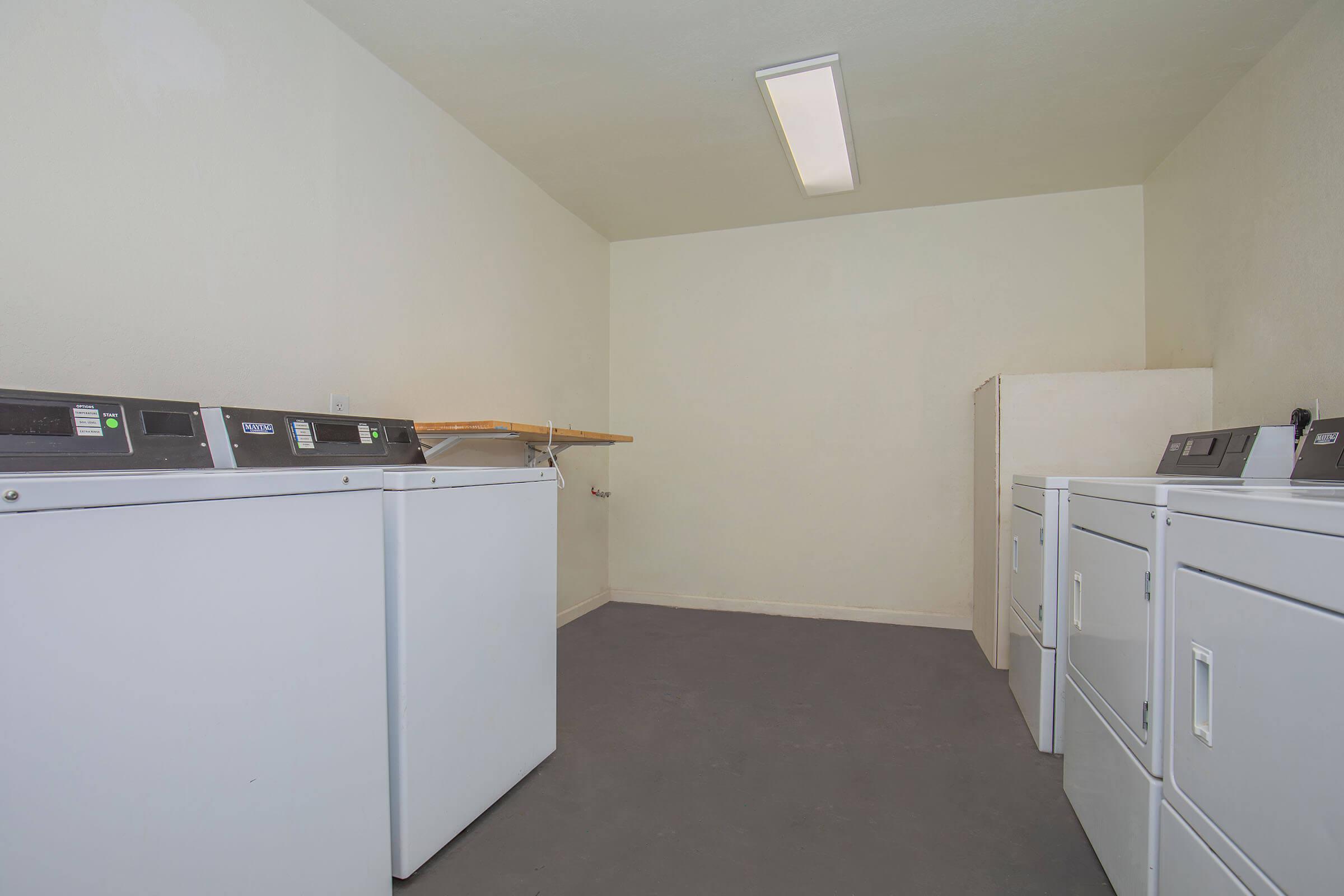 a kitchen with a stove and a refrigerator