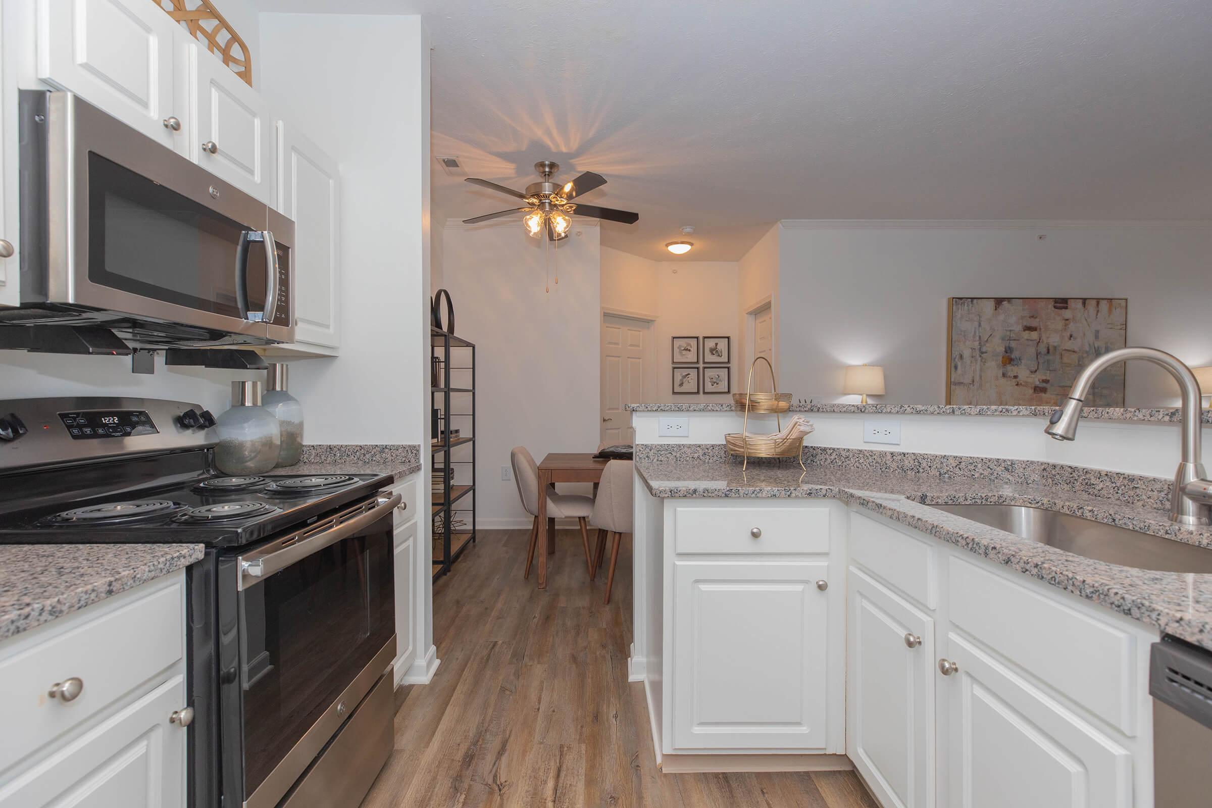 a kitchen with a stove top oven