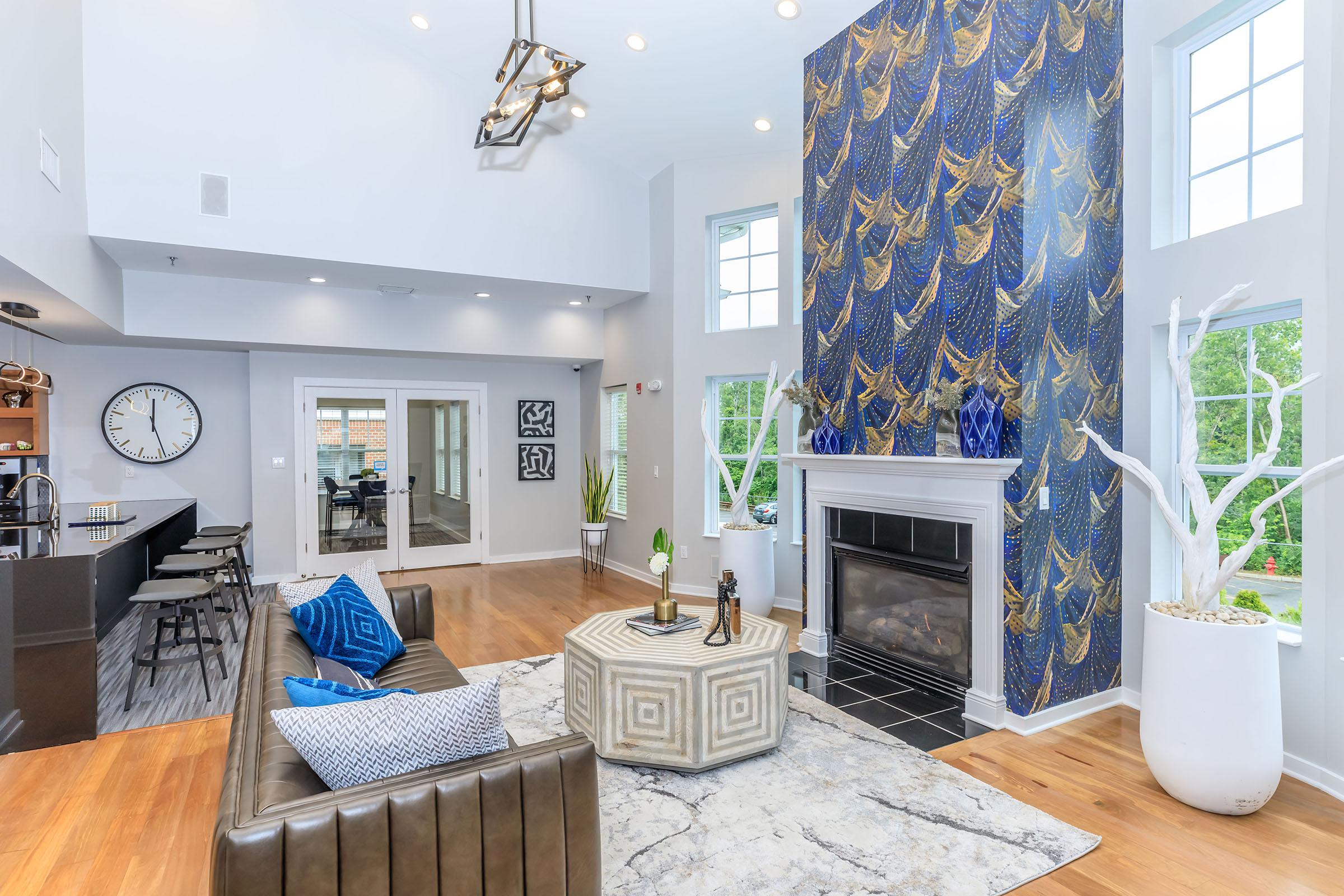 a living room filled with furniture and a fireplace