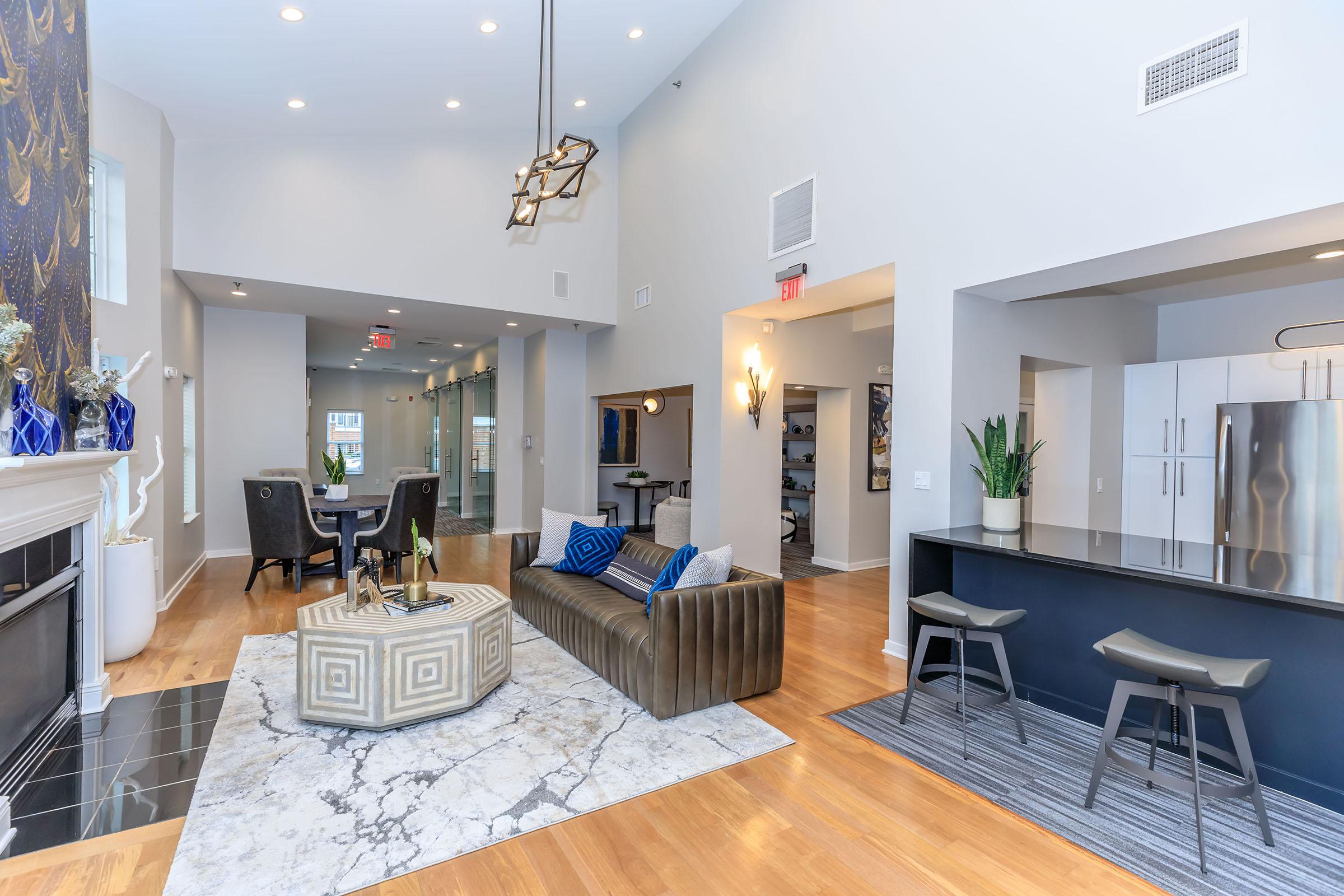 a living room filled with furniture and a table