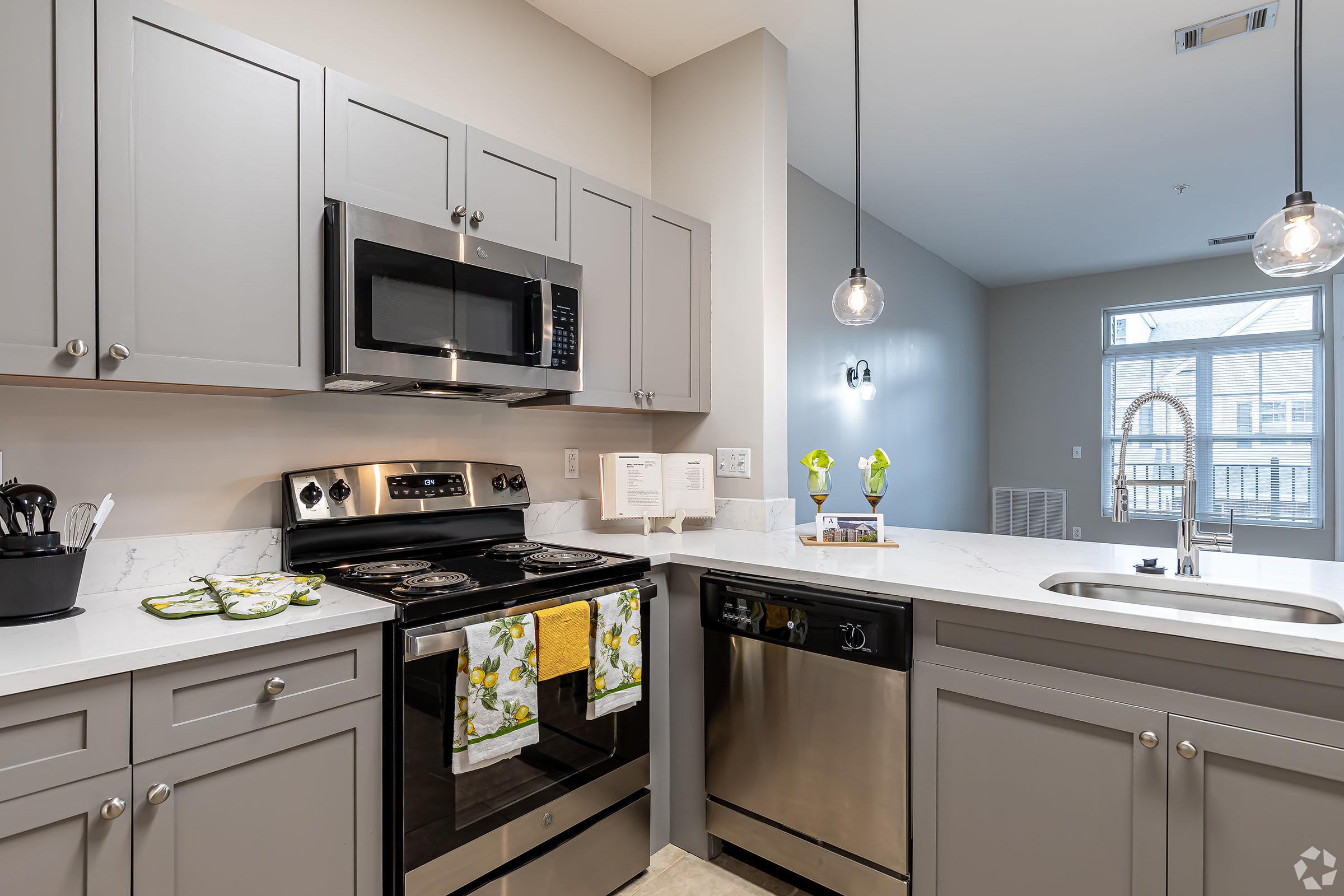 a kitchen with a sink and a microwave