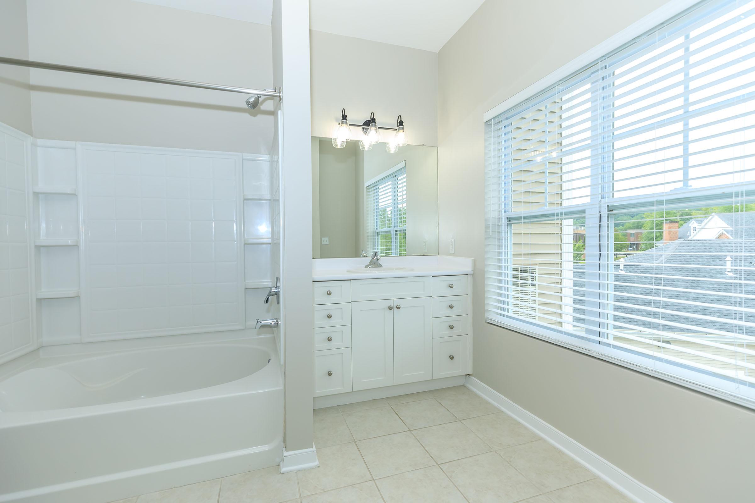 a room with a sink and a window