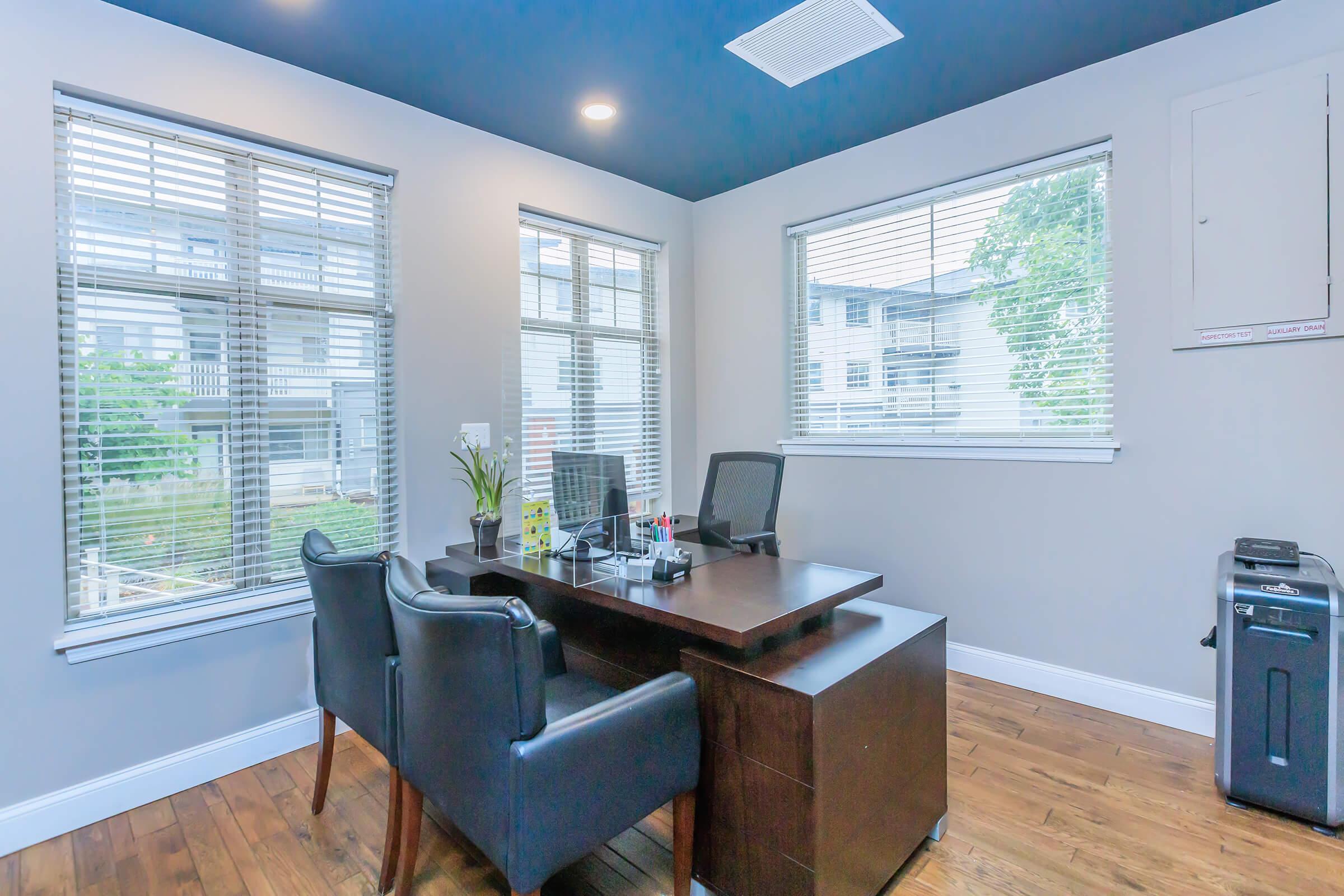 a living room filled with furniture and a large window