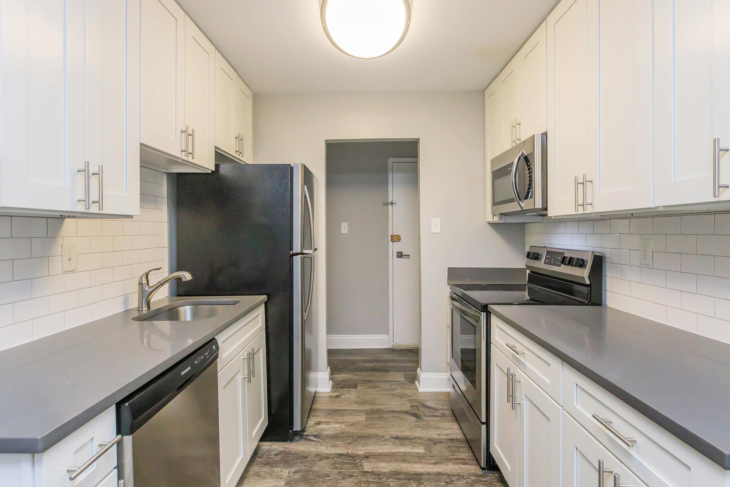 a kitchen with a stove and a sink