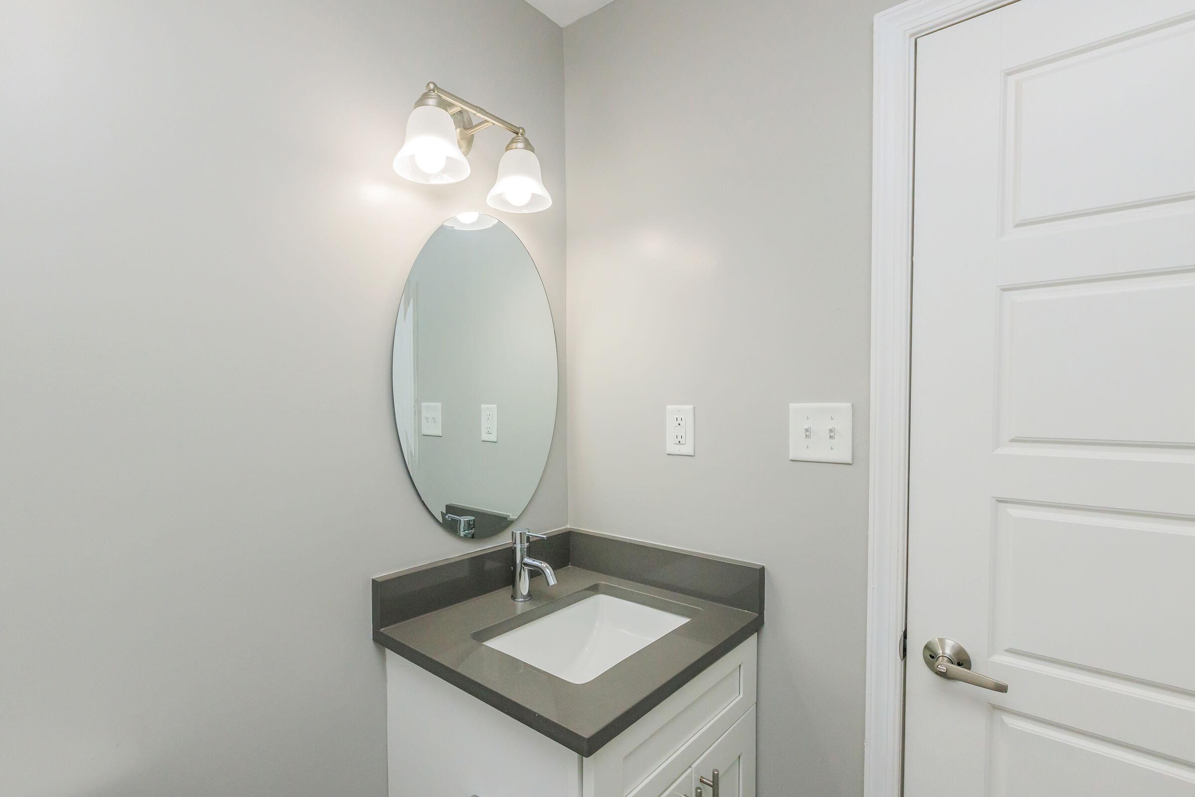 a close up of a sink and a mirror