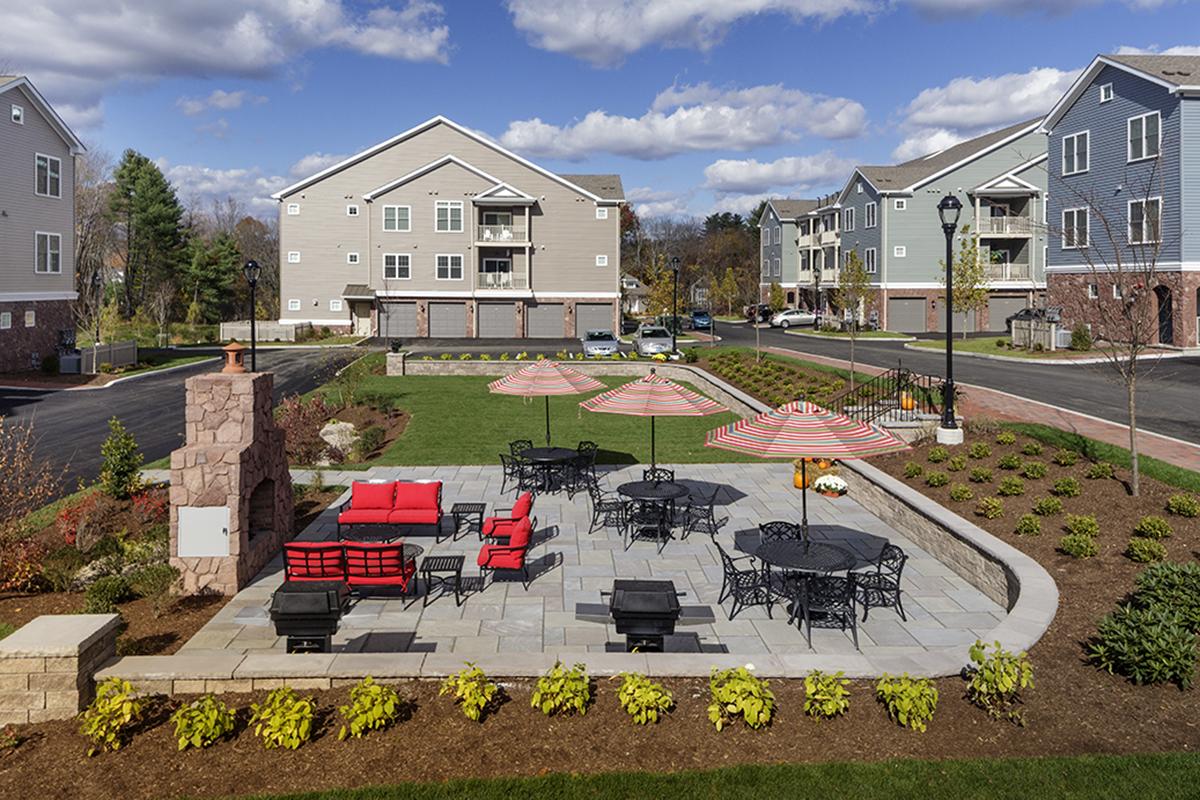 a house with a lawn in front of a building