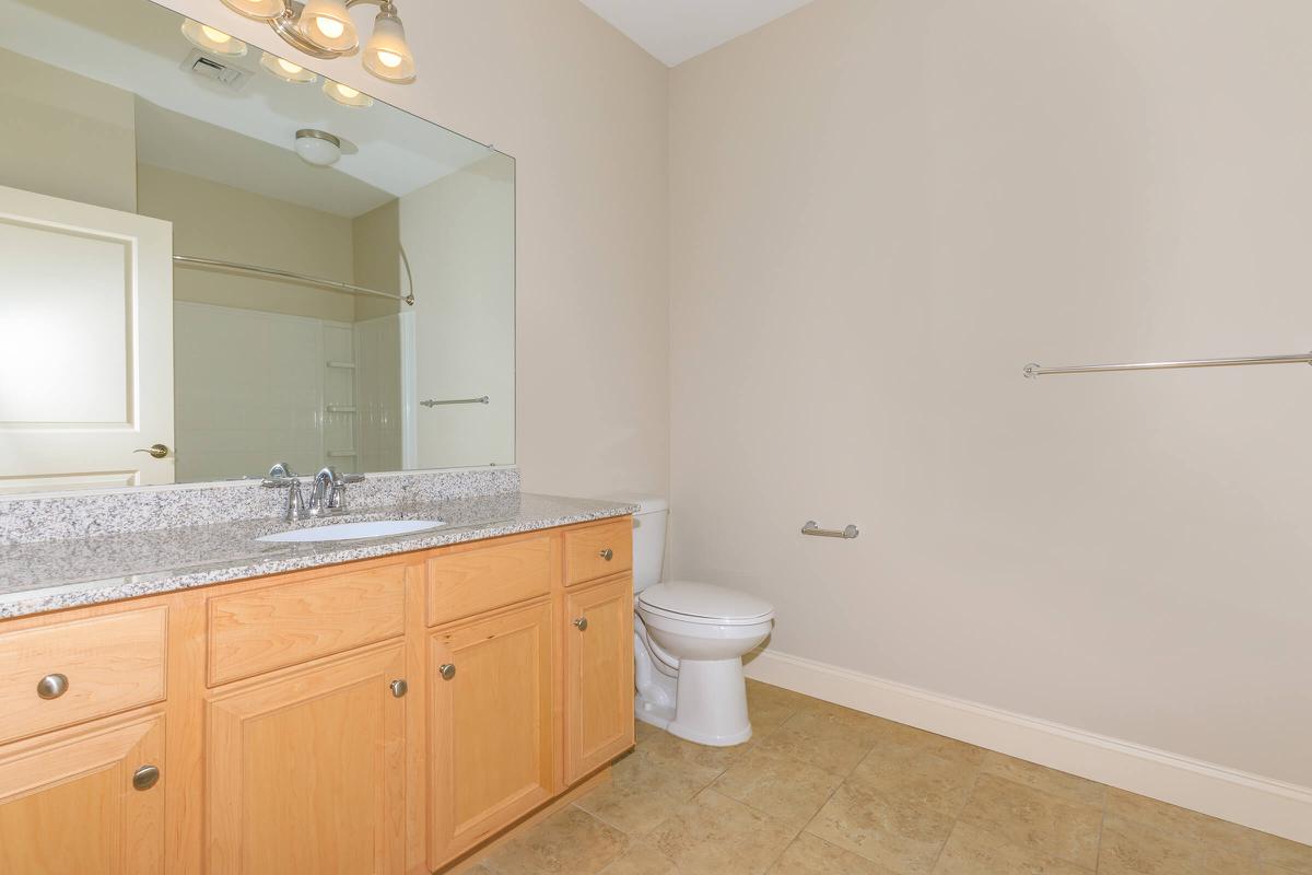 a kitchen with a sink and a mirror