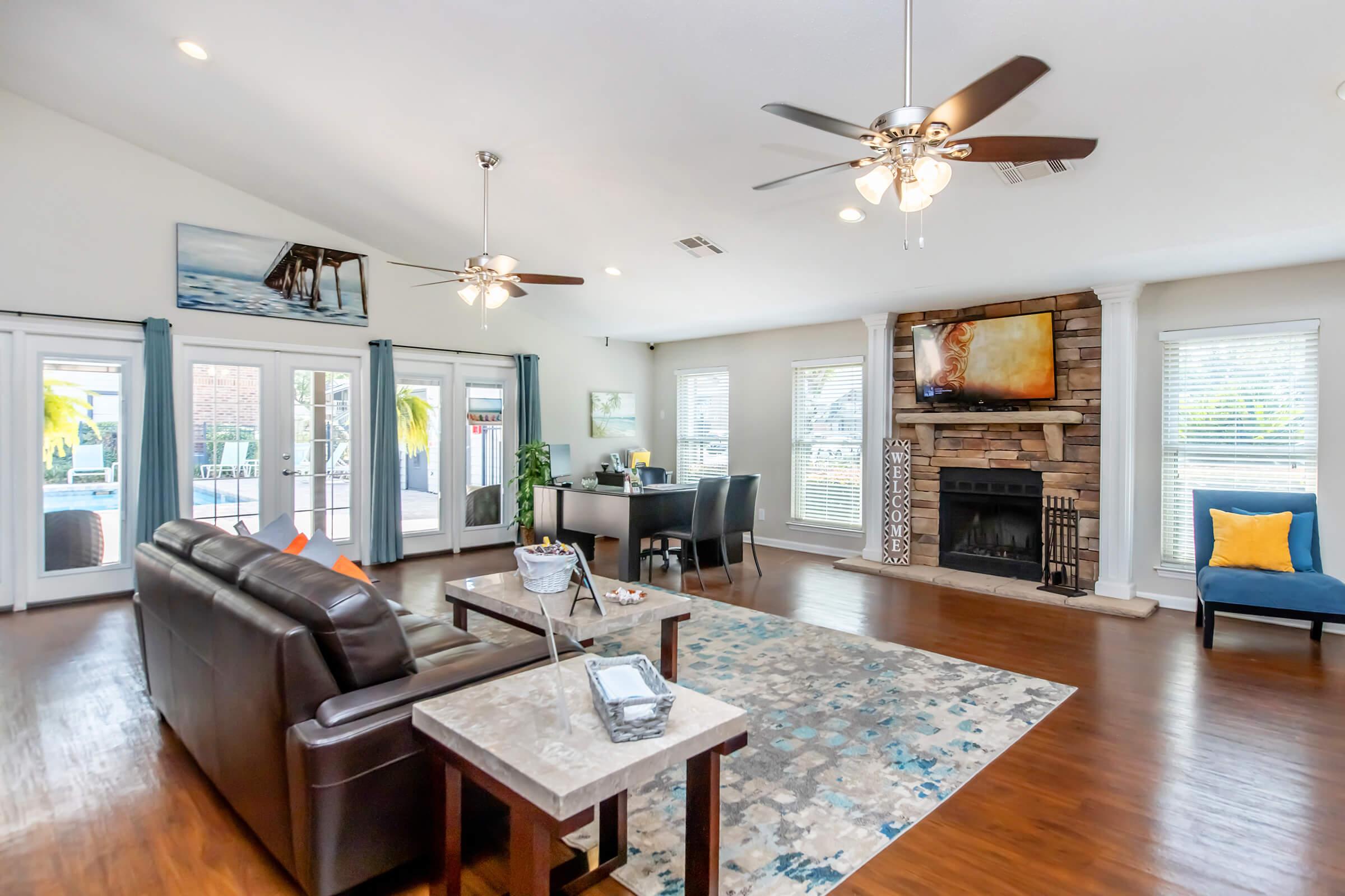 a living room filled with furniture and a fireplace