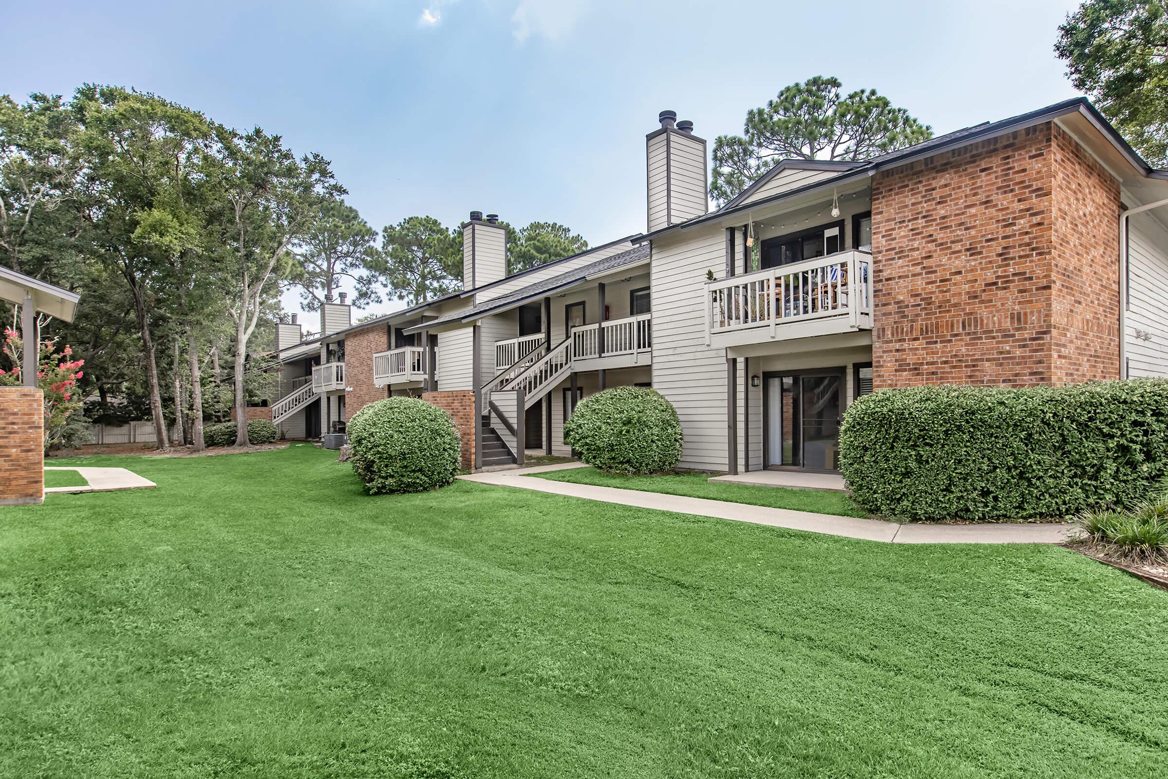 a large lawn in front of a house