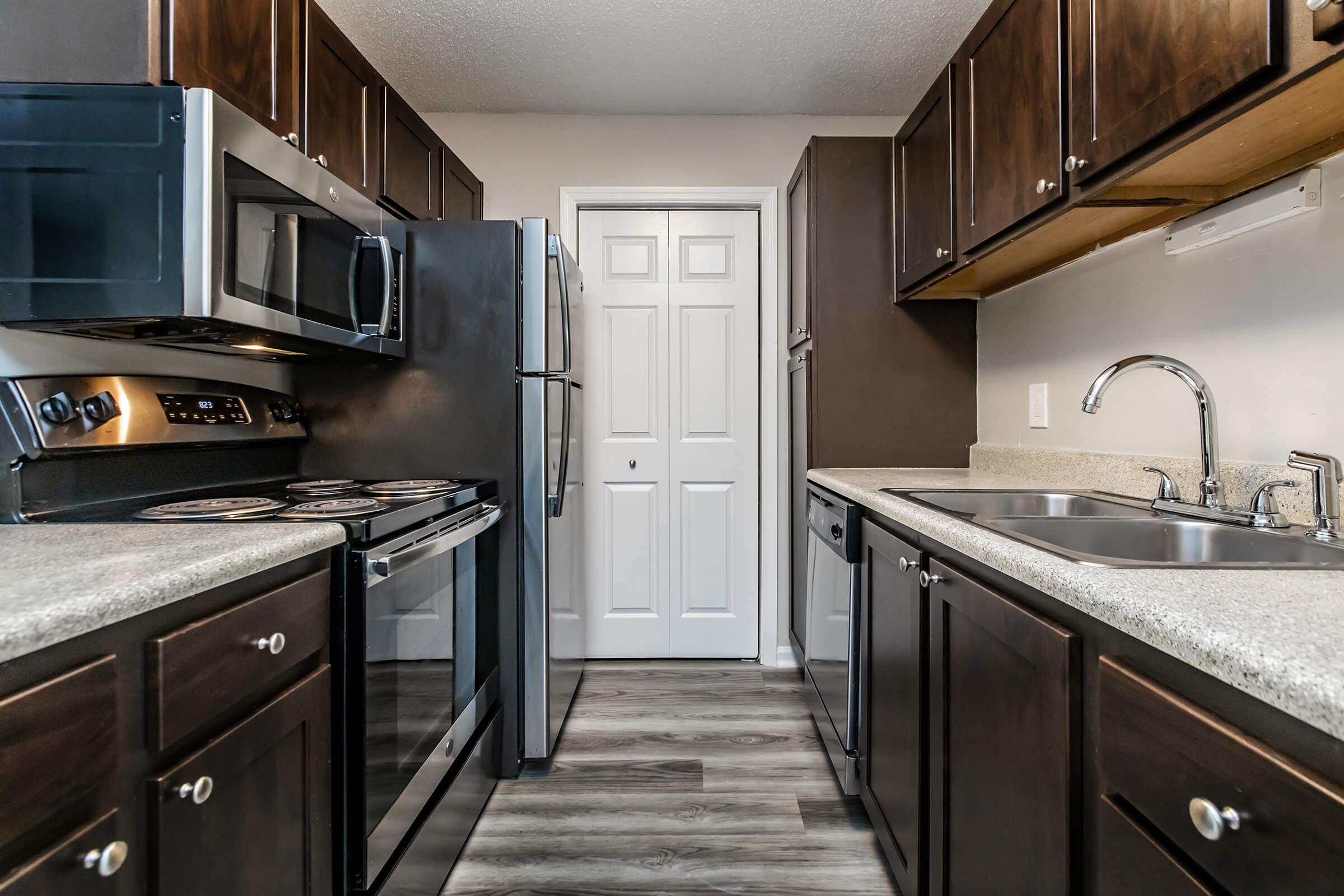 a large kitchen with stainless steel appliances