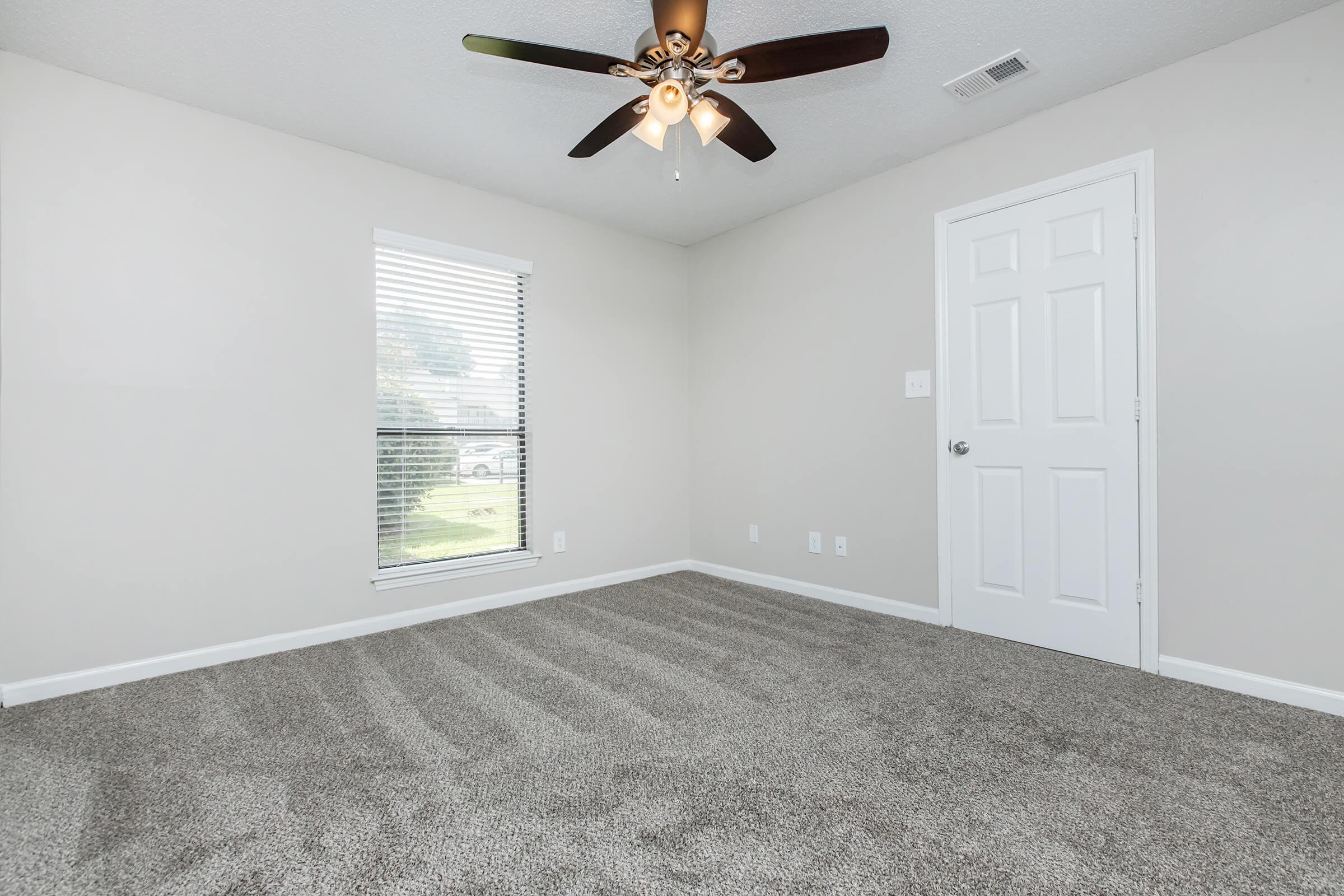 a bedroom with a large mirror