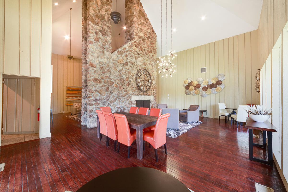 a living room filled with furniture and a fireplace
