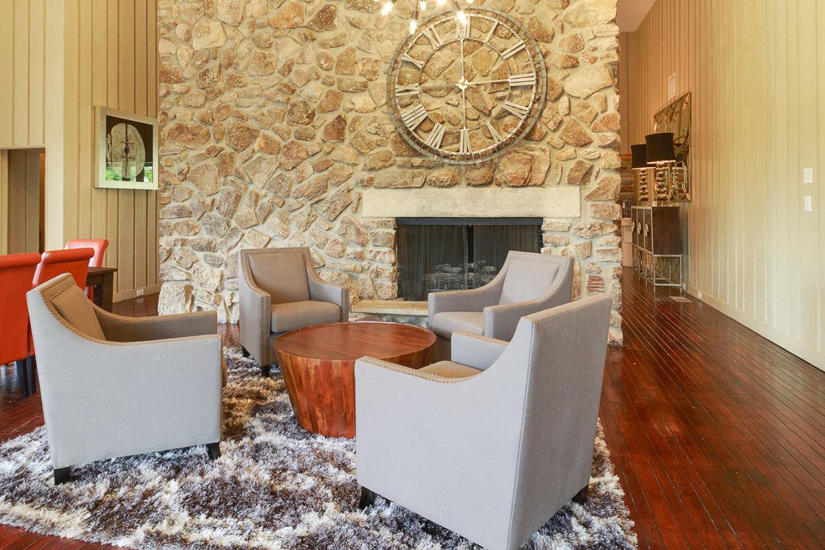 a living room filled with furniture and a fireplace
