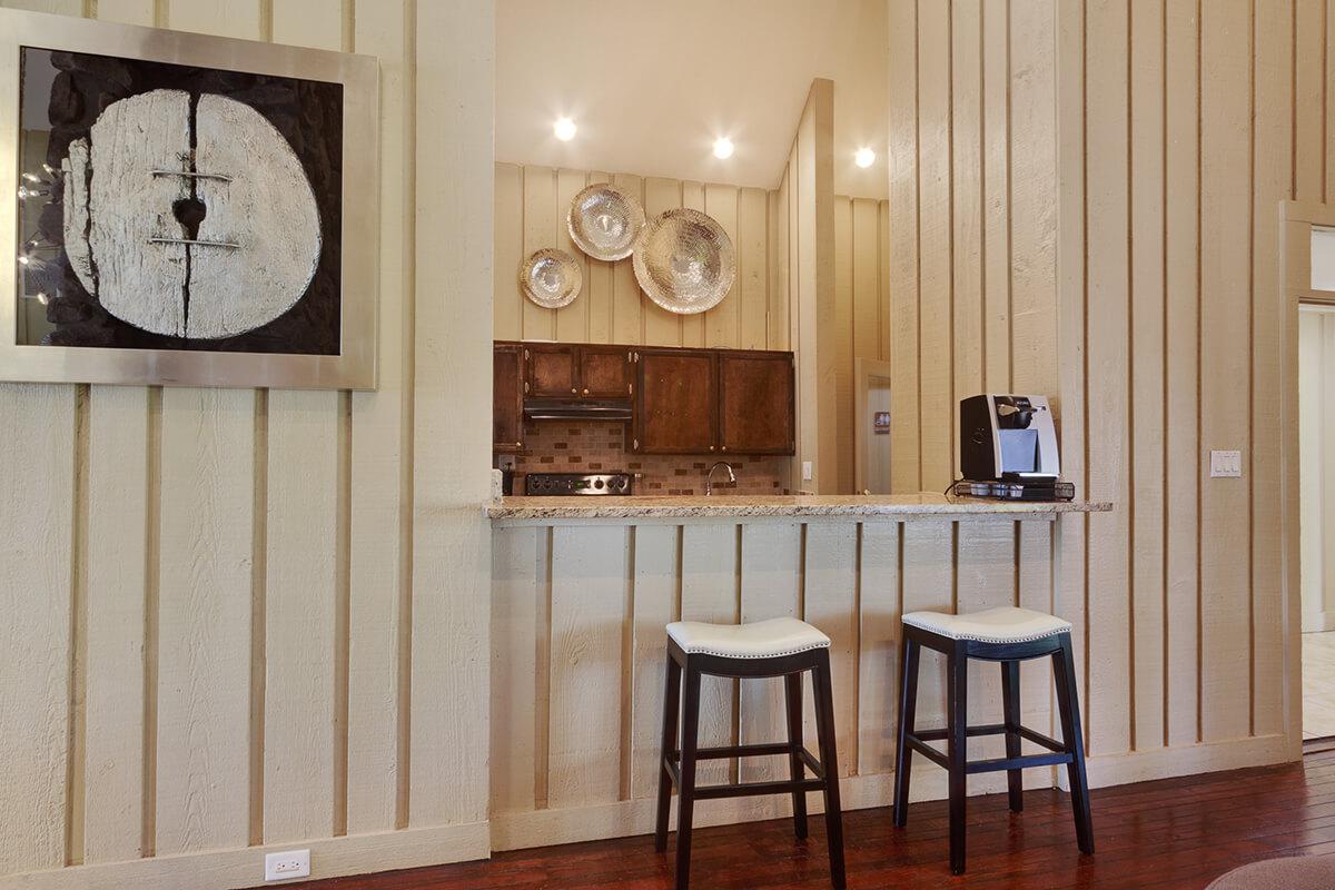 a room that has a clock on top of a wooden table
