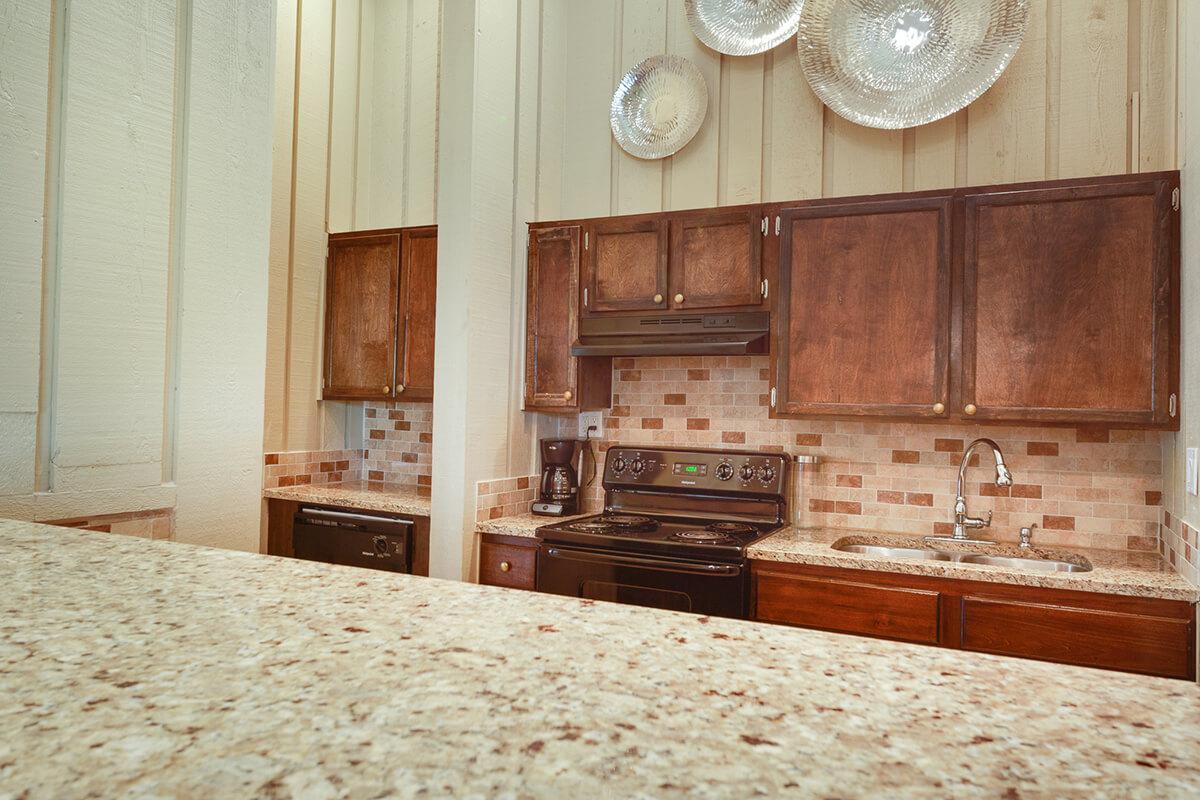 a kitchen with wooden cabinets