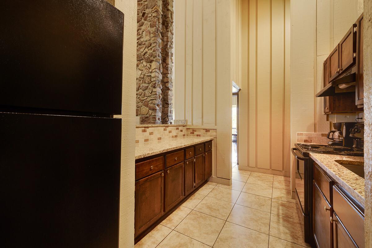 a stainless steel refrigerator in a kitchen