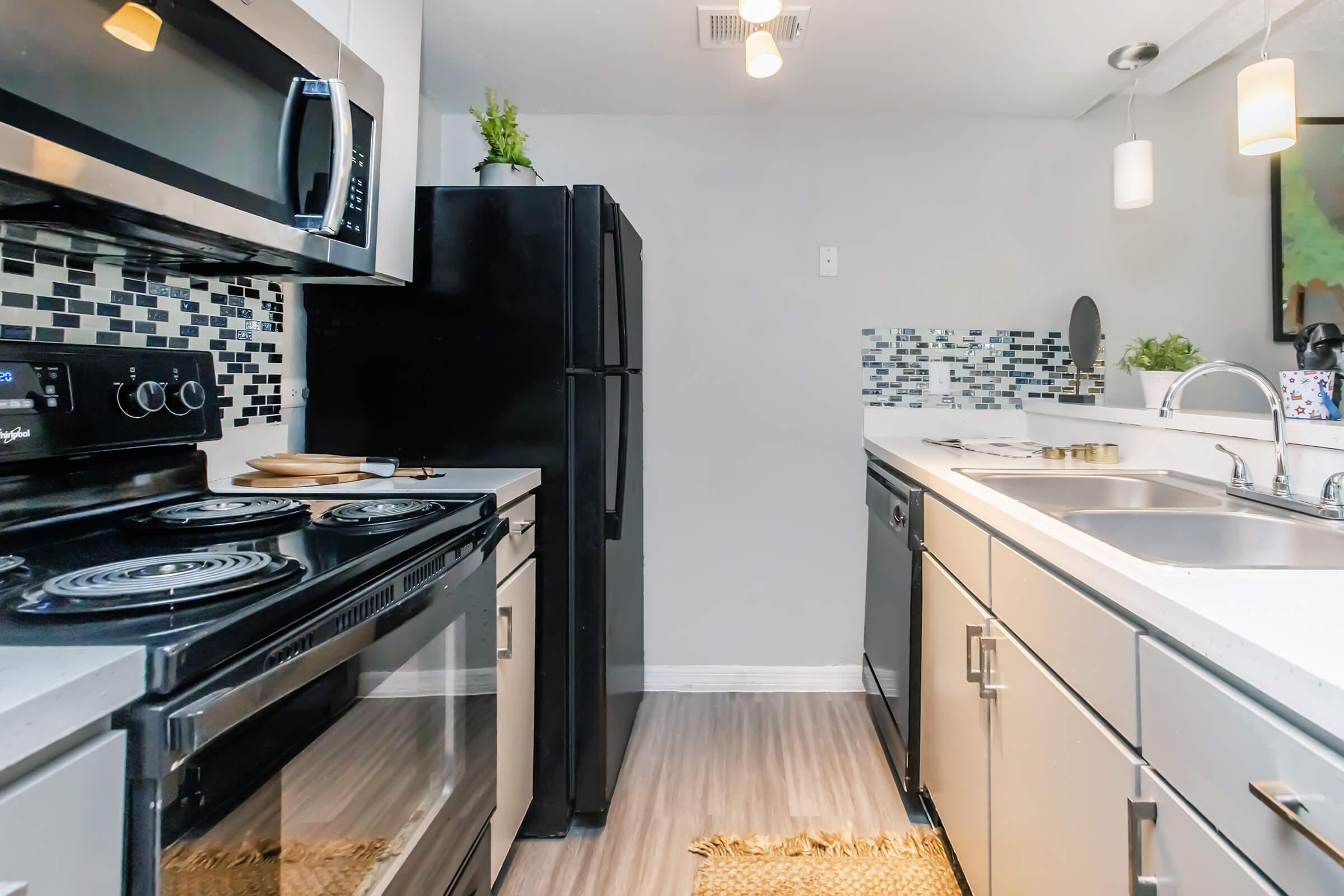 a modern kitchen with stainless steel appliances