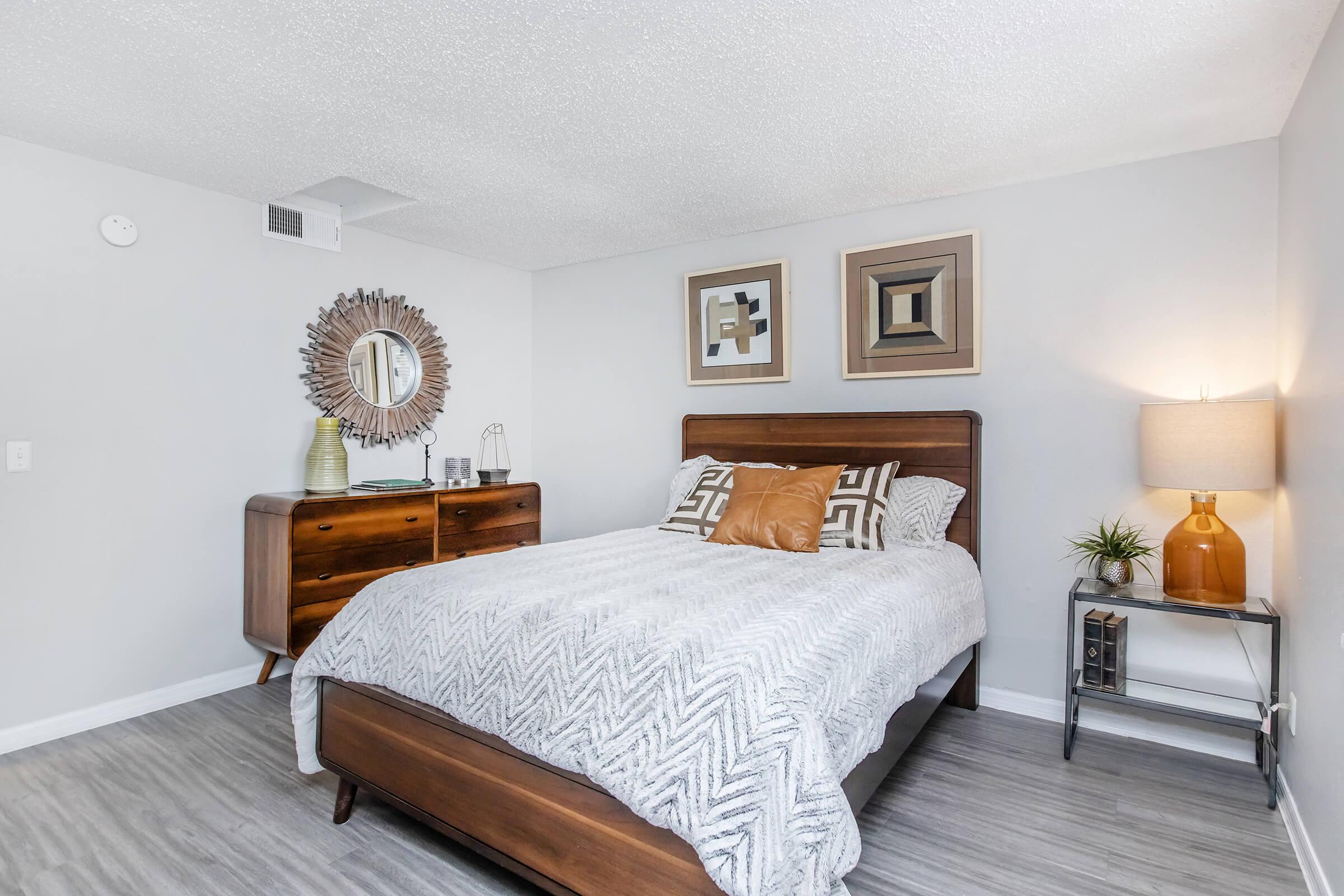 a bedroom with a large bed in a room