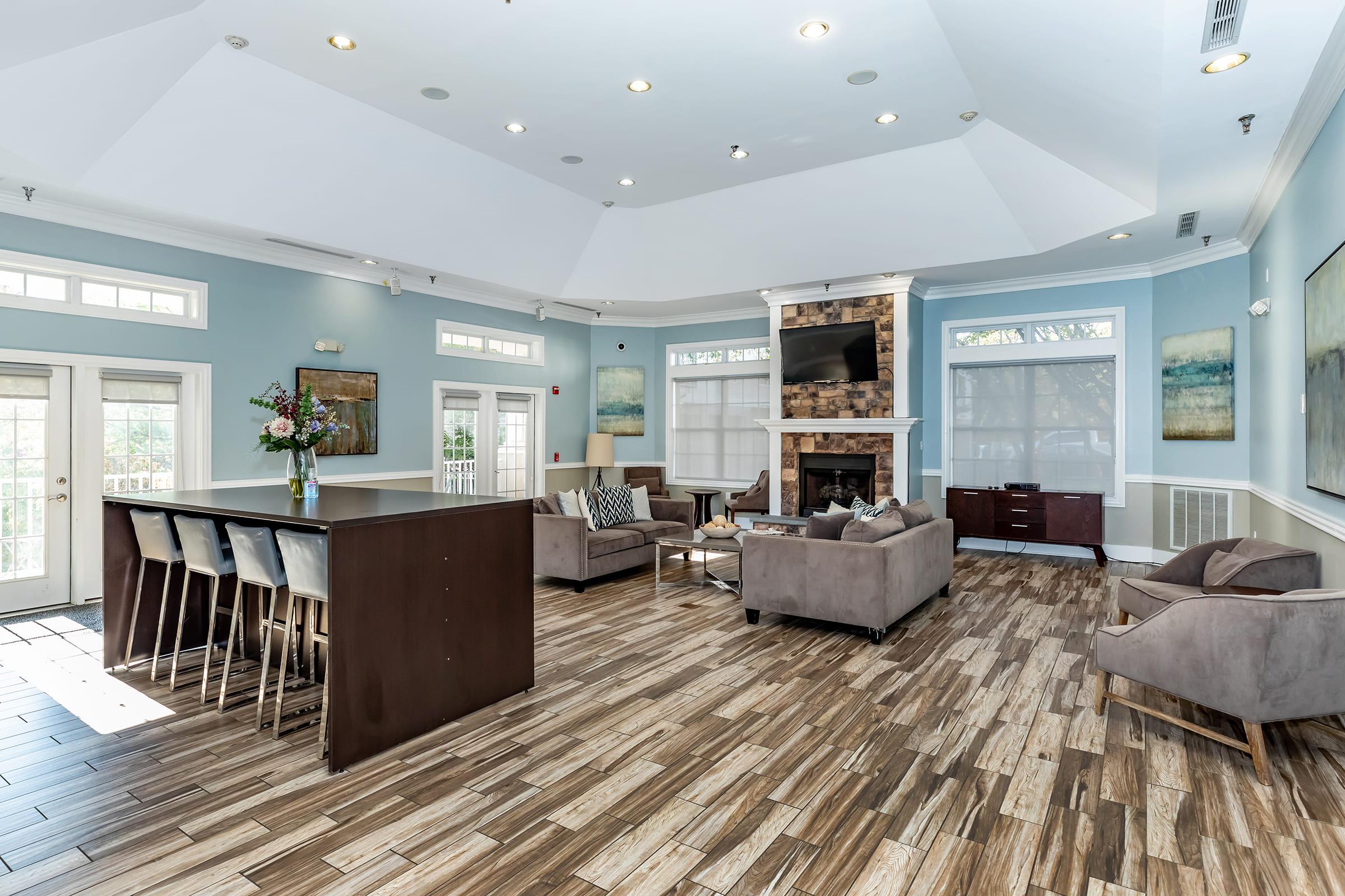 a living room filled with furniture and a large window