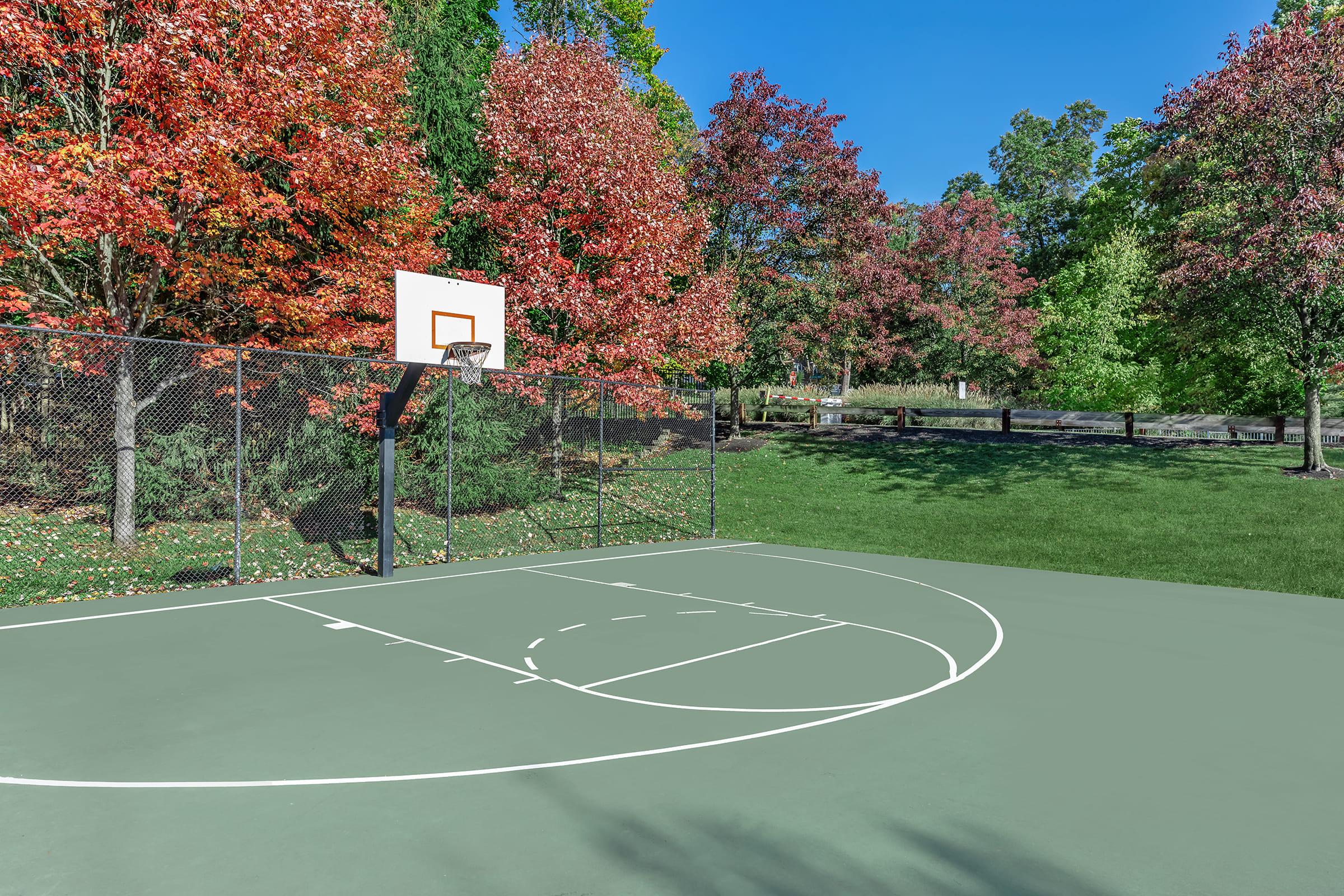 a basketball on a court with a racquet