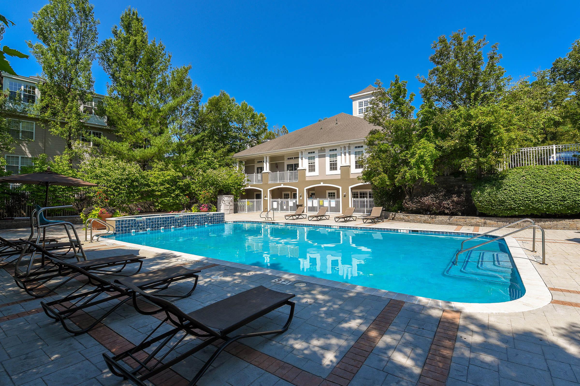 a blue bench in a pool