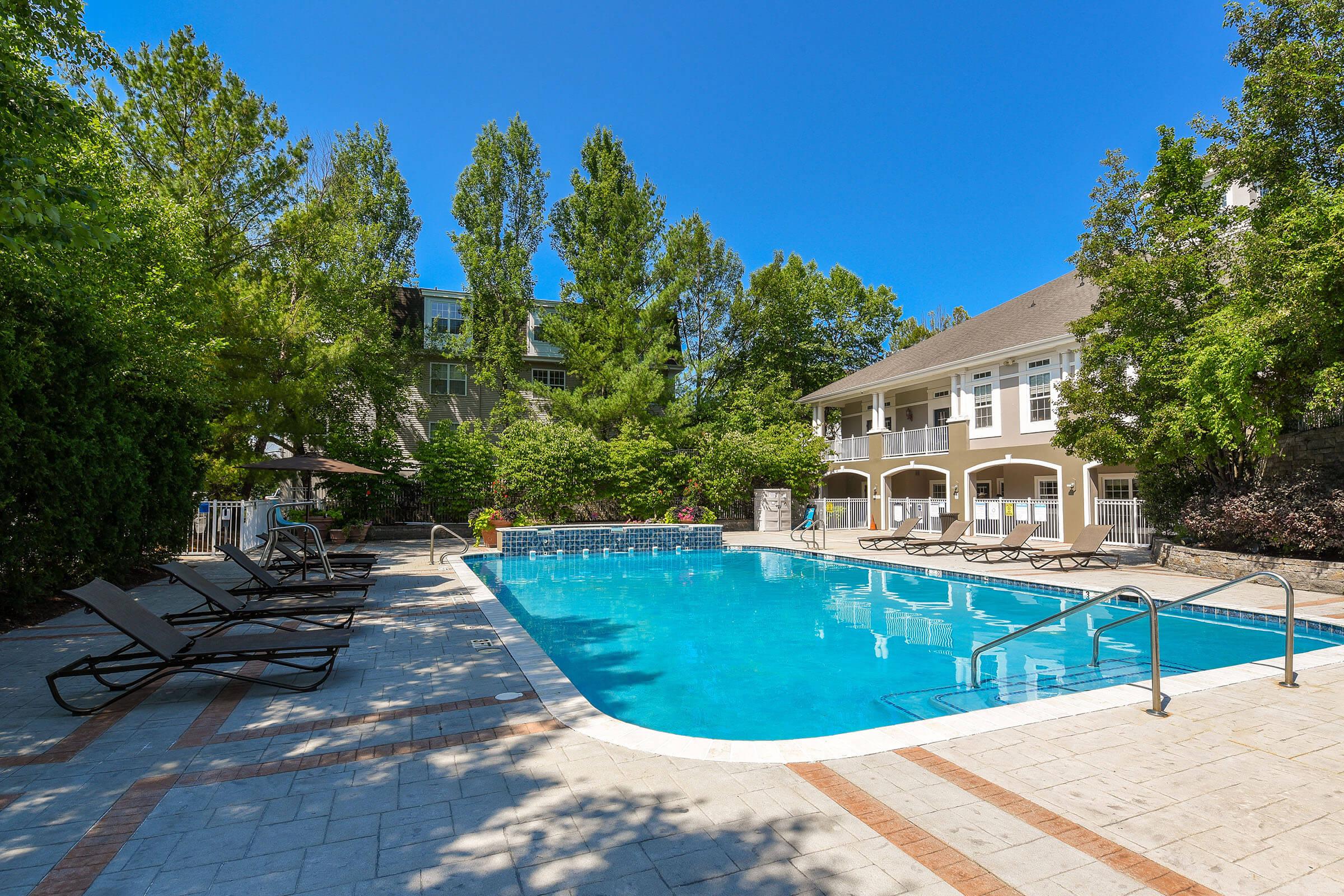 SOAK UP THE SUN BY THE SHIMMERING SWIMMING POOL