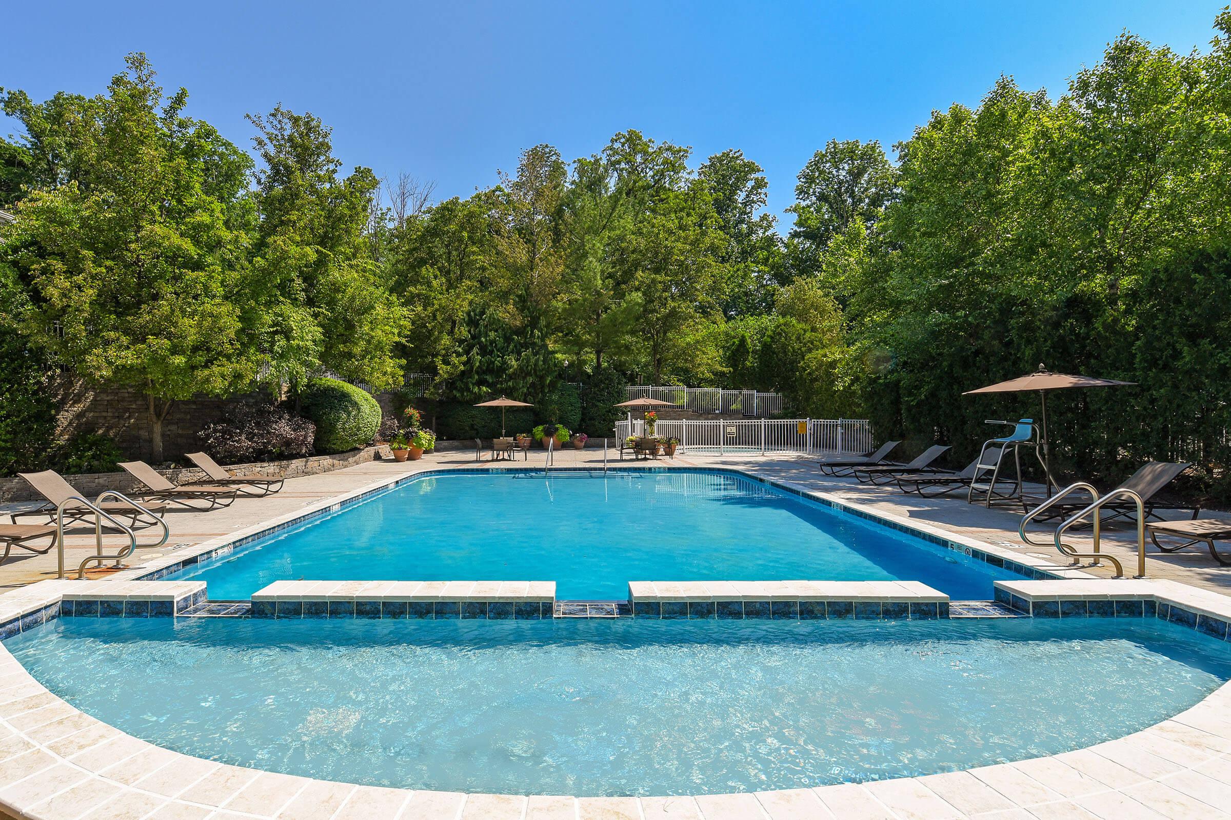 a pool next to a body of water