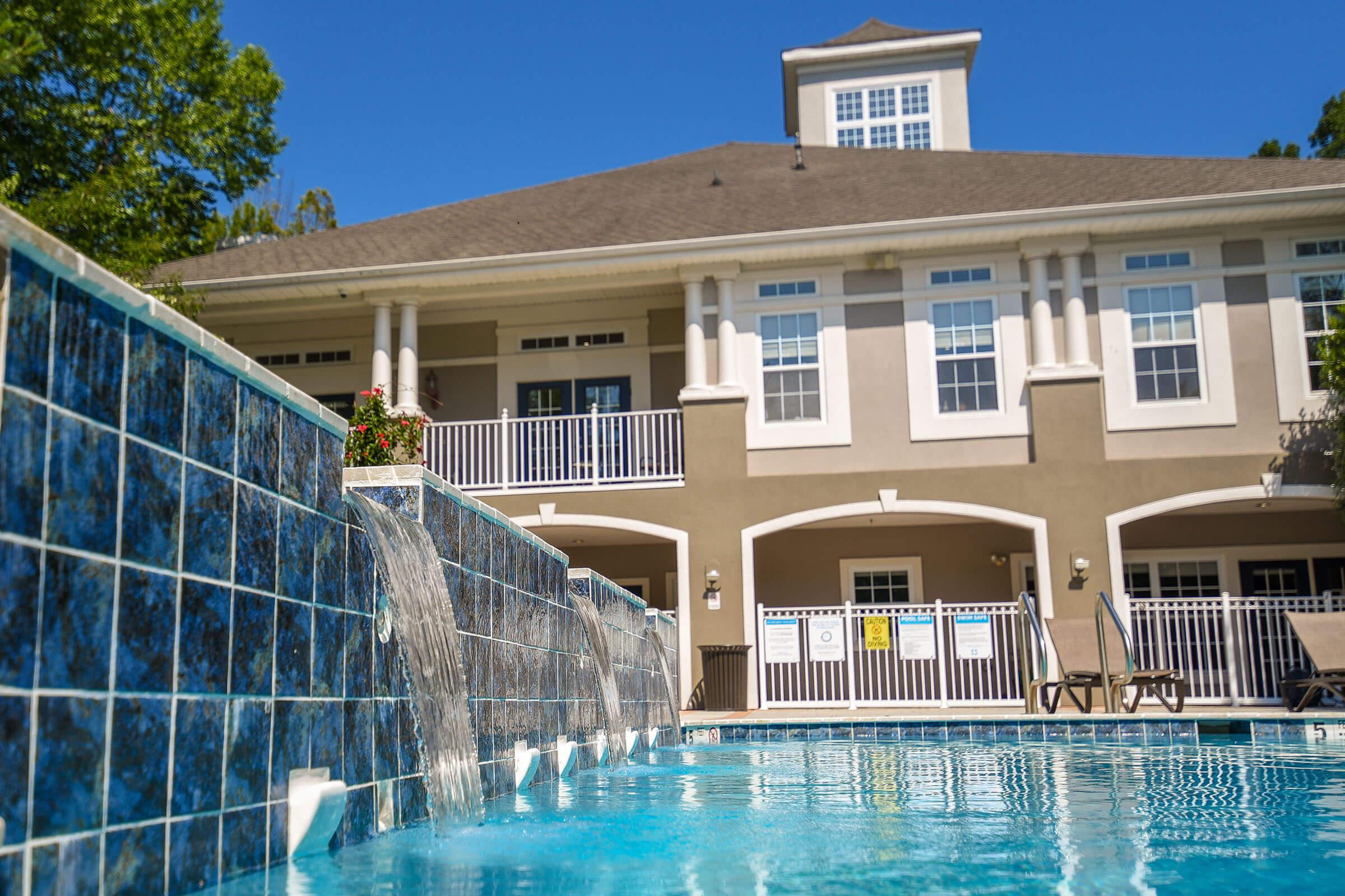 a large pool of water in front of a building