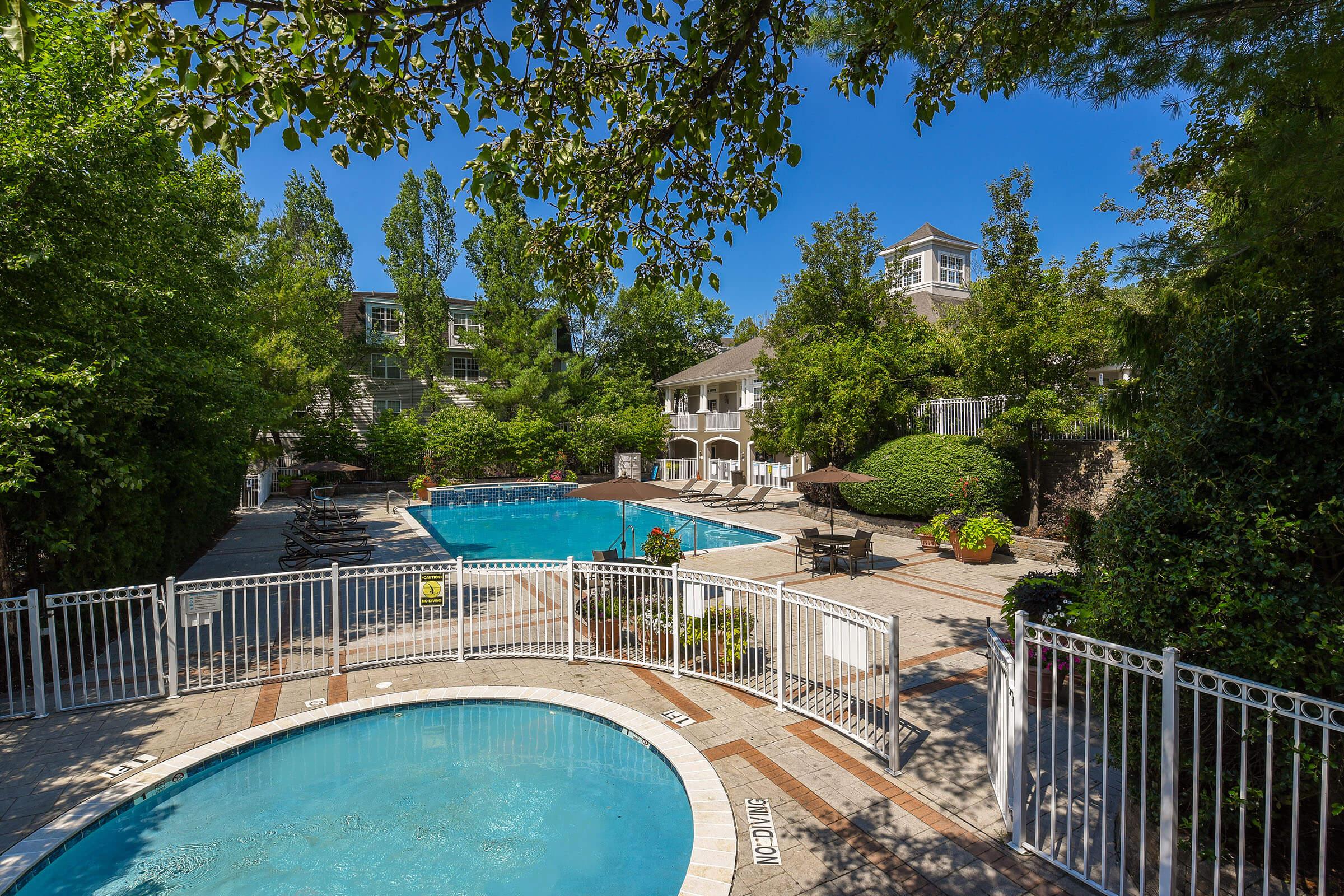 a pool next to a fence