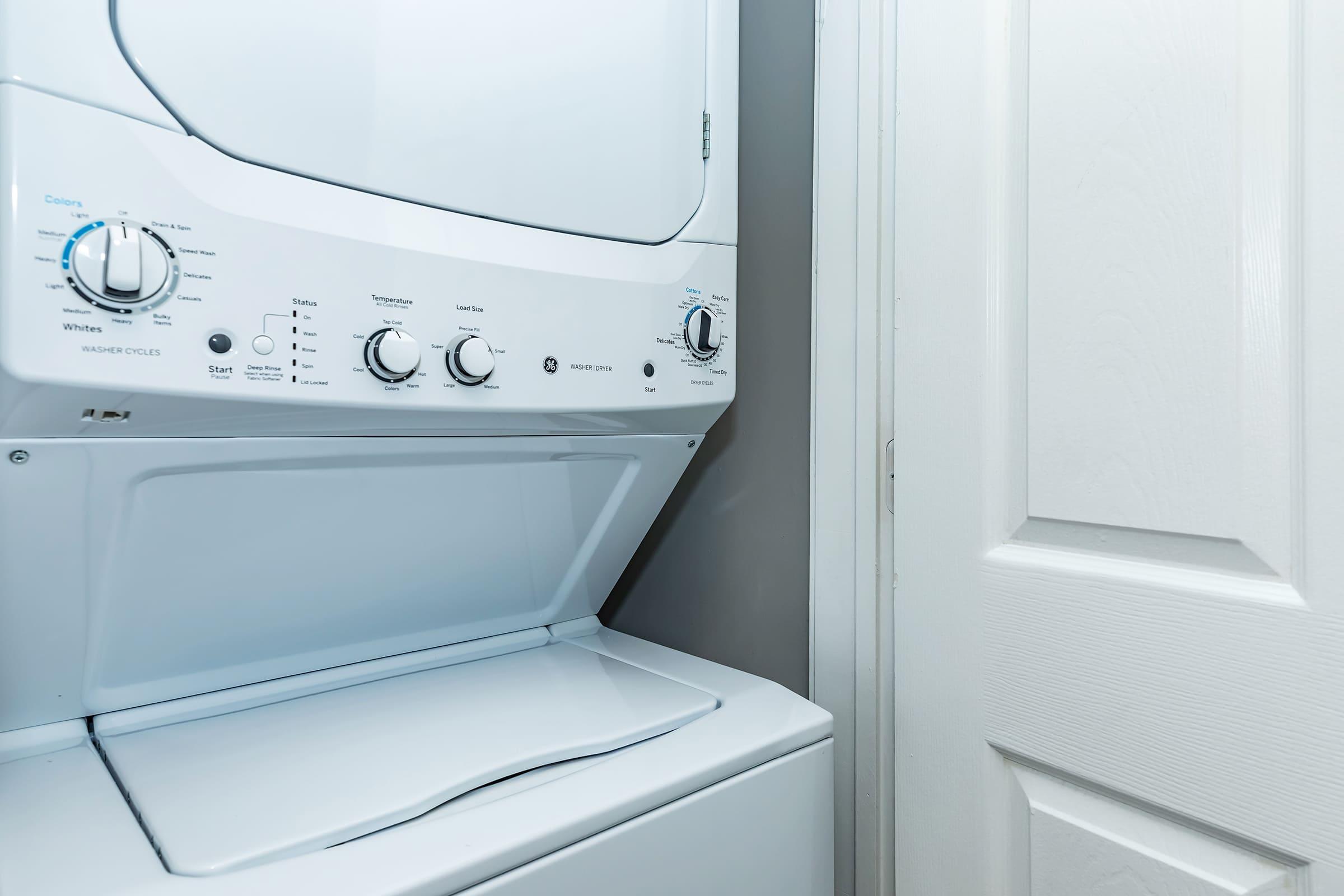 a microwave oven sitting on top of a refrigerator