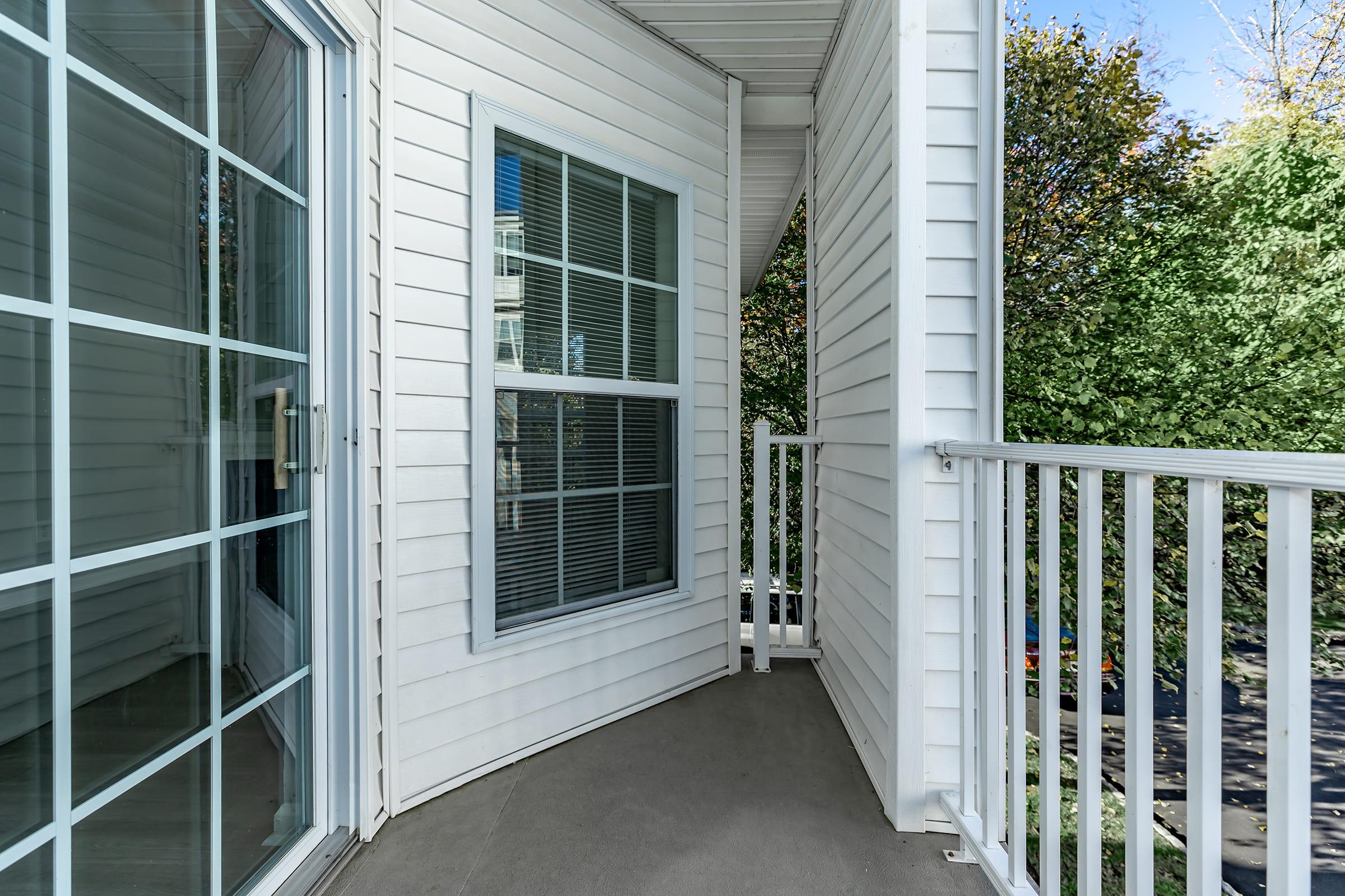 a building with a fence in front of a window