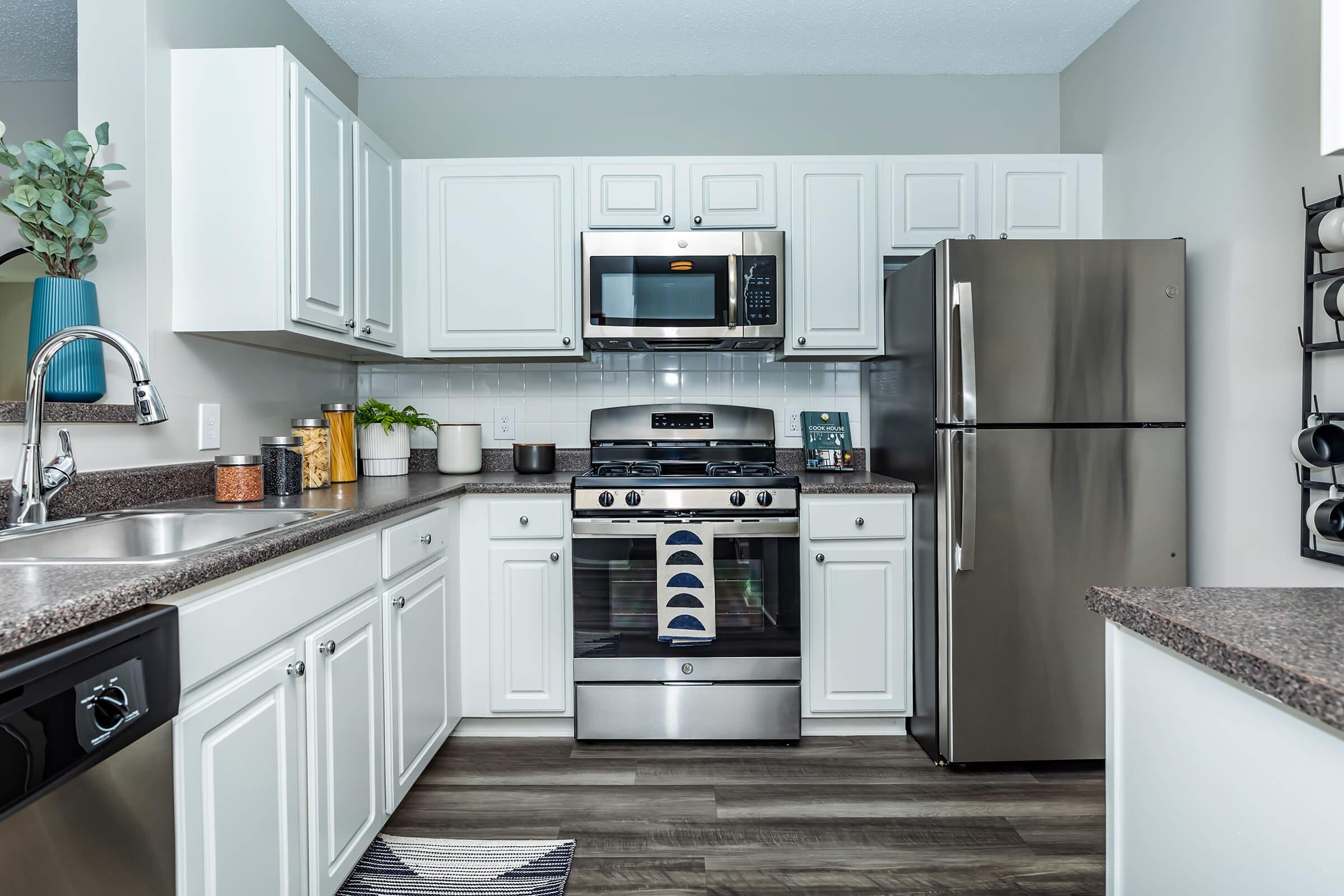 a modern kitchen with stainless steel appliances