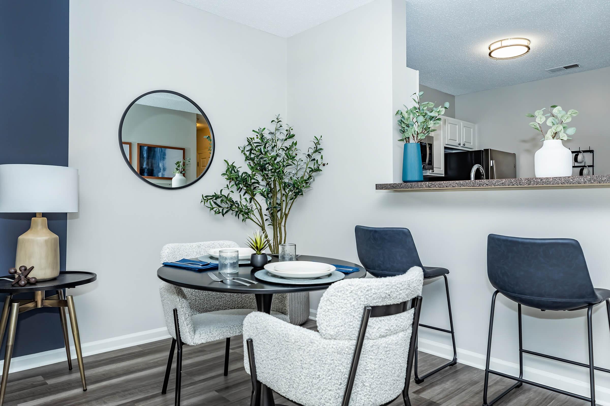 a living room filled with furniture and a table