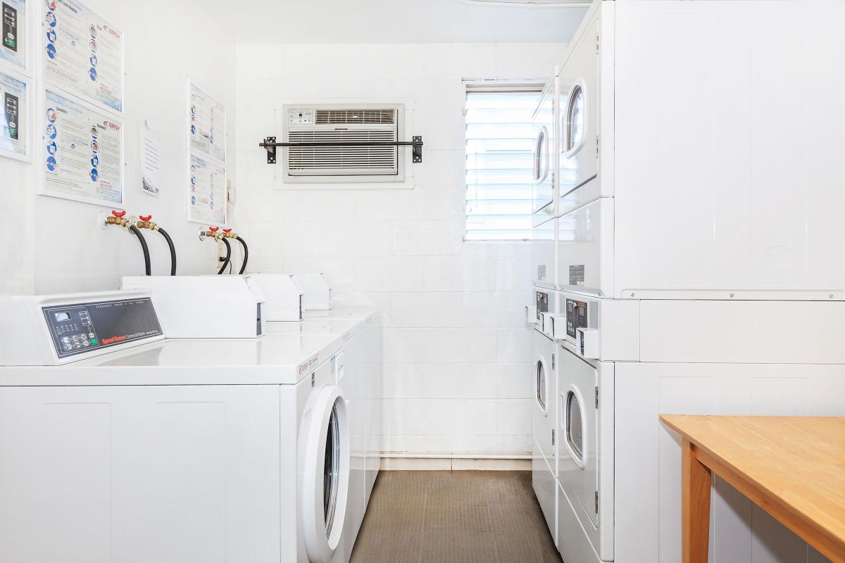 a white refrigerator freezer sitting inside of a kitchen
