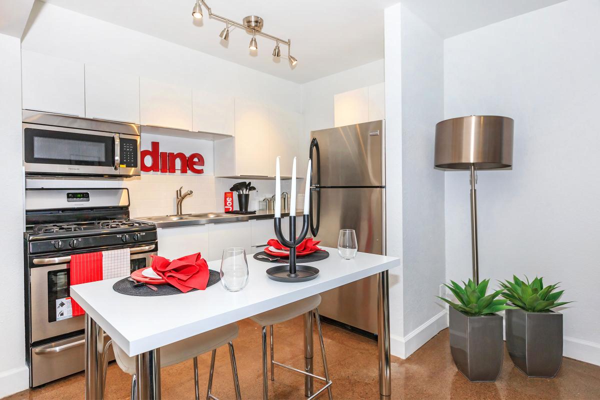 a kitchen with a table in a room