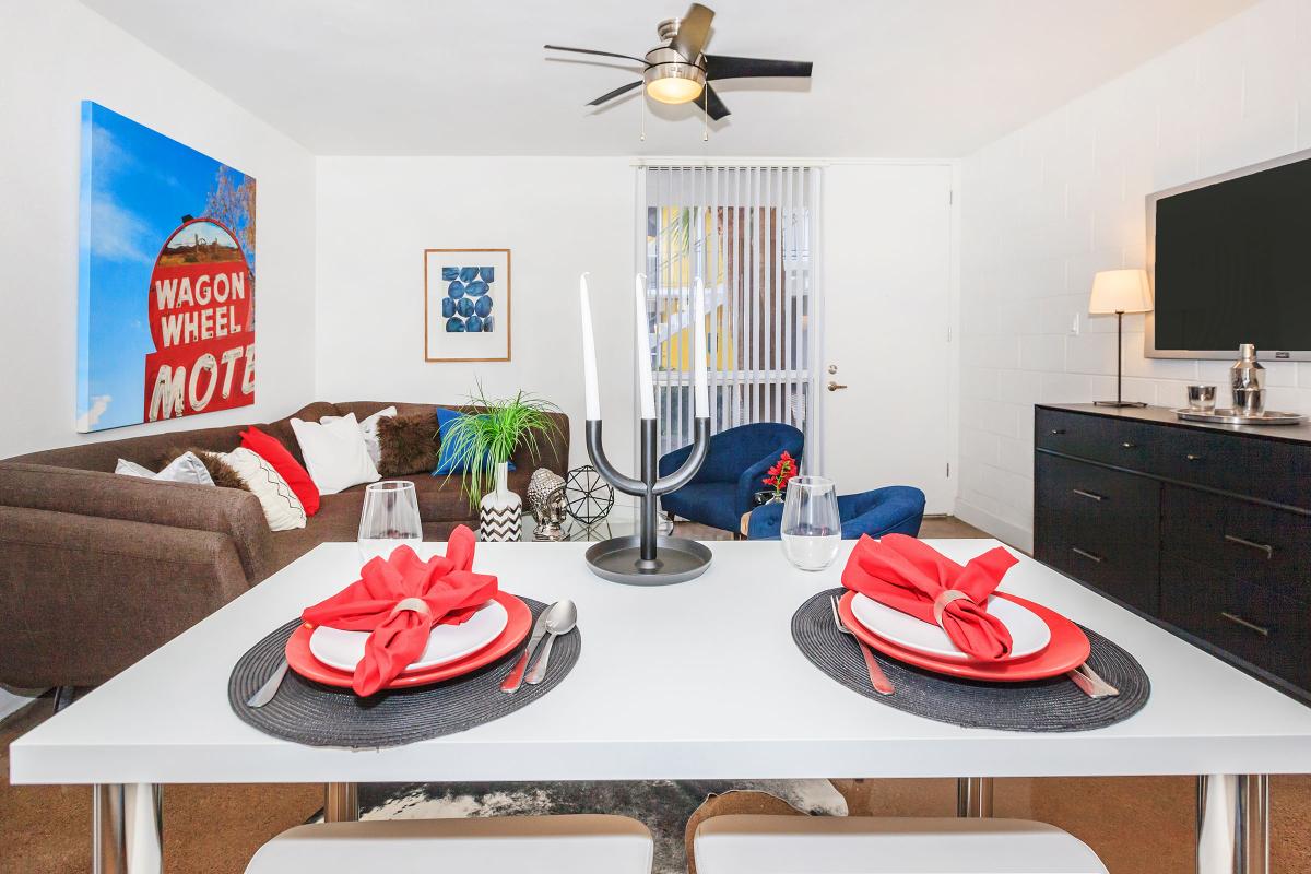 a living room filled with furniture and a flat screen tv