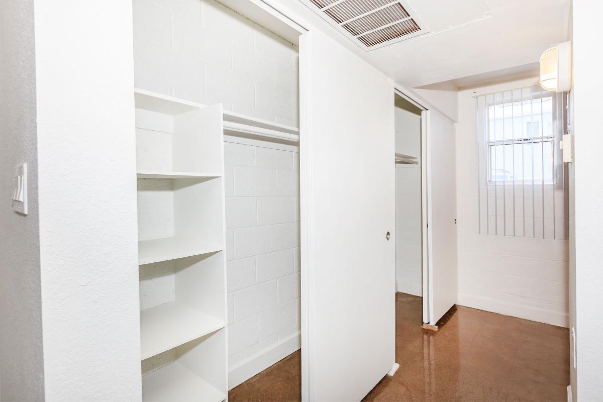 a white refrigerator freezer sitting inside of a building