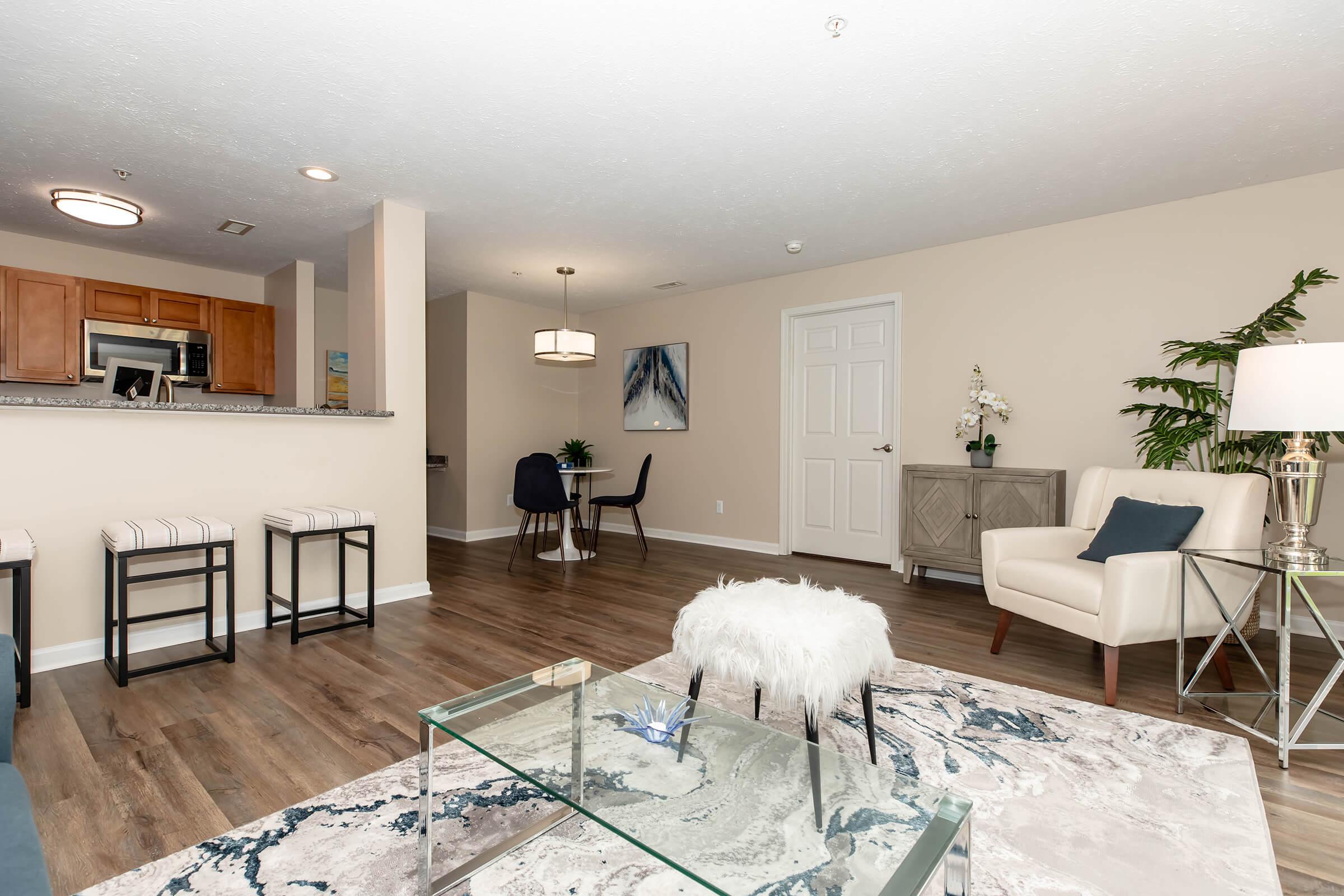 a living room filled with furniture and a flat screen tv