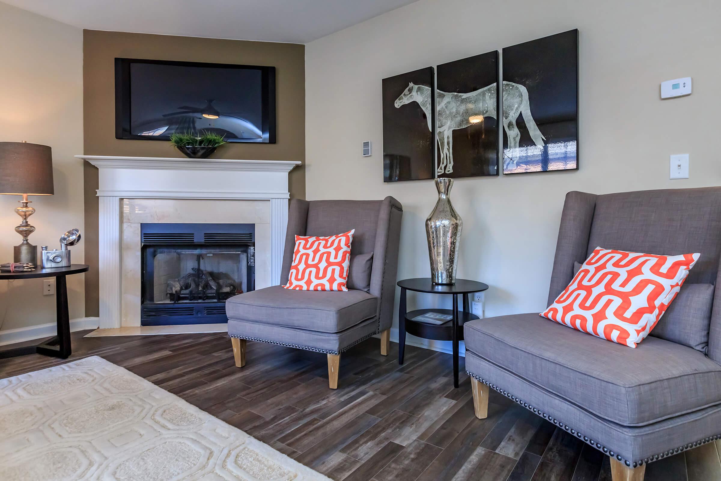 a living room filled with furniture and a fireplace