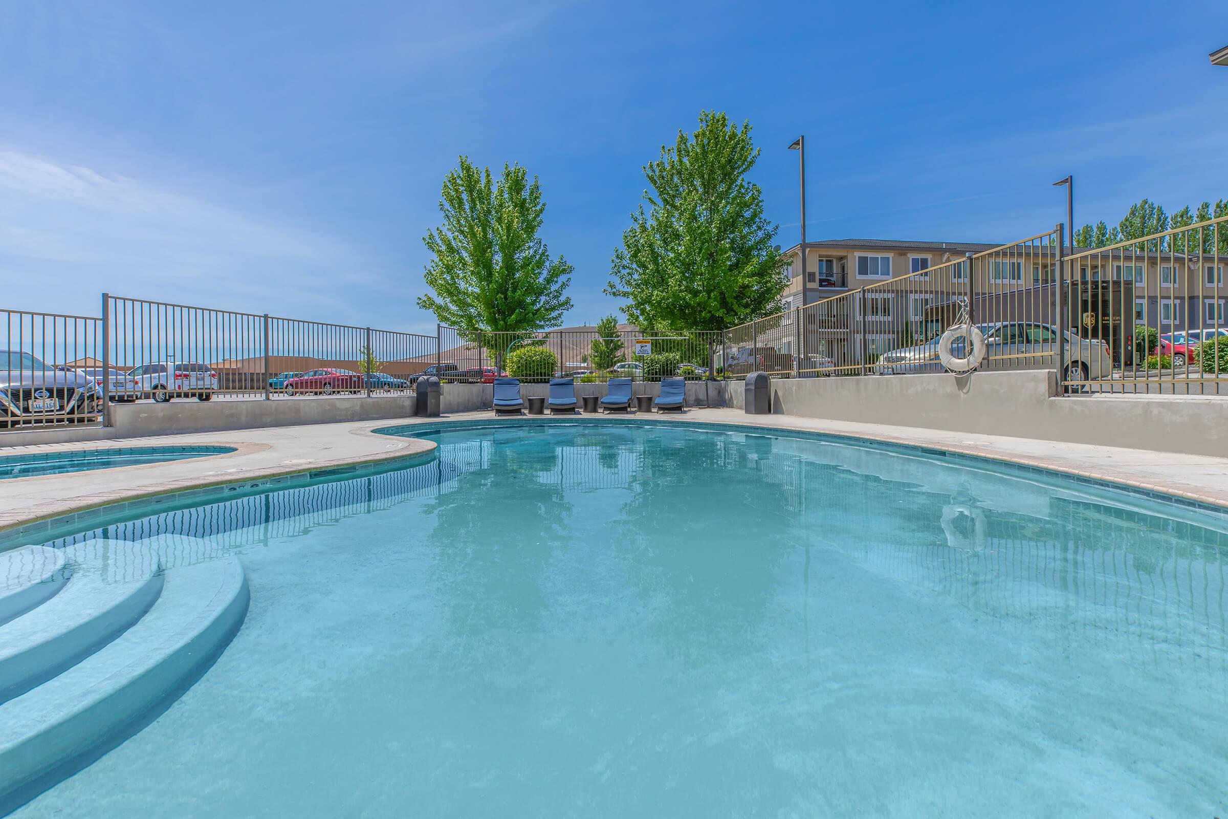 a pool next to a body of water