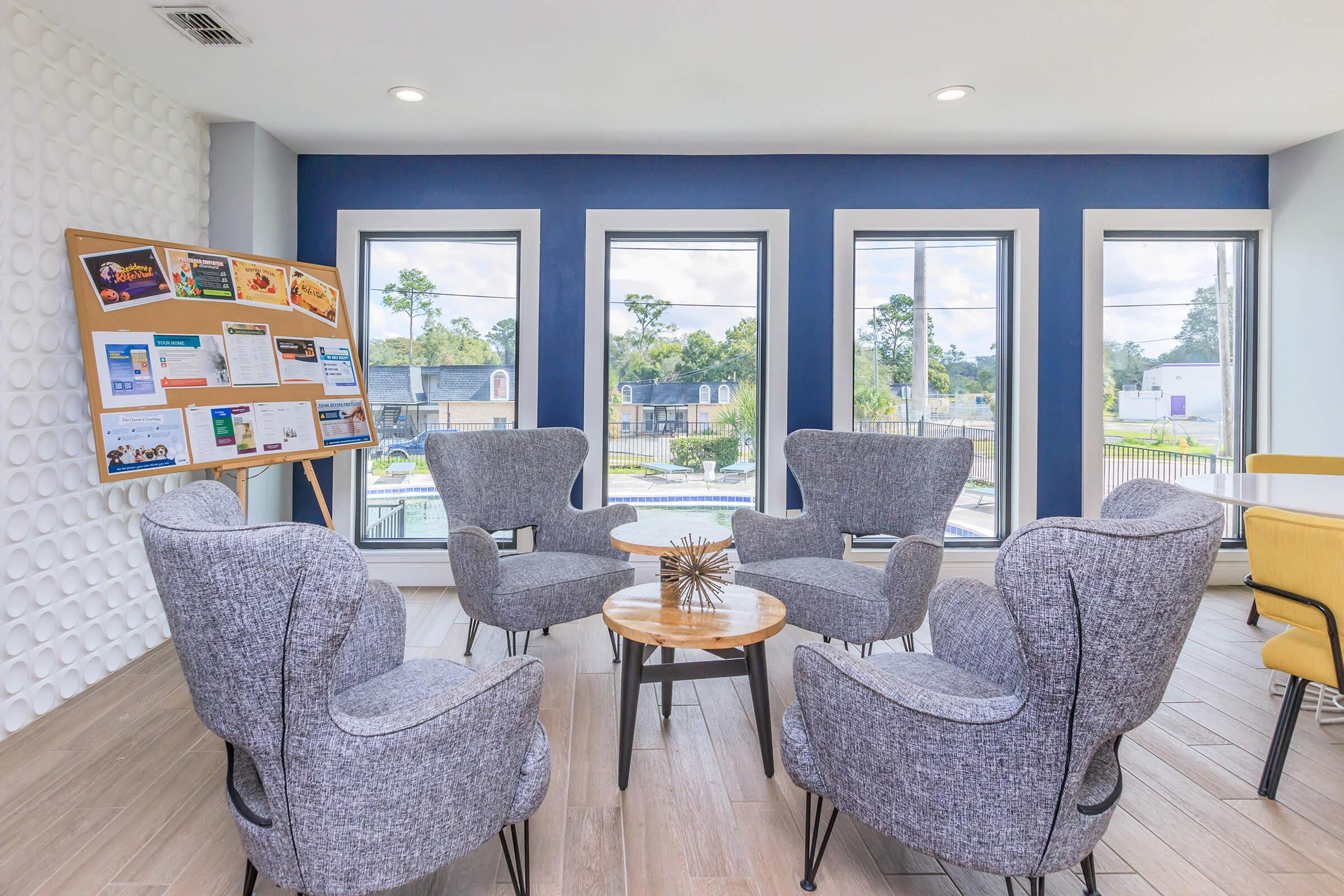 a living room filled with furniture and decor