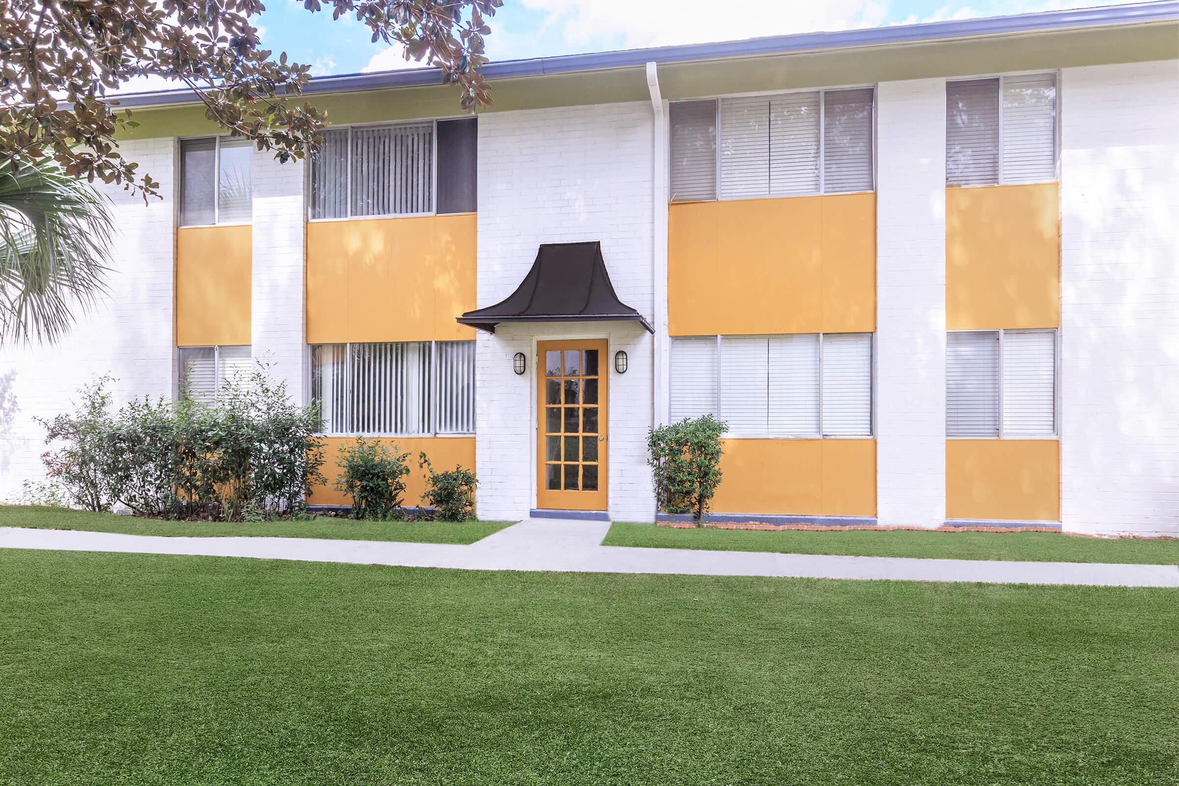 a large lawn in front of a house