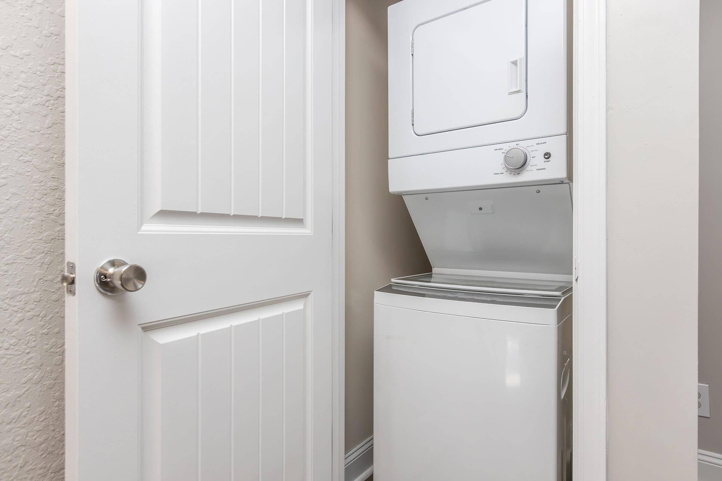 a refrigerator freezer sitting next to a door