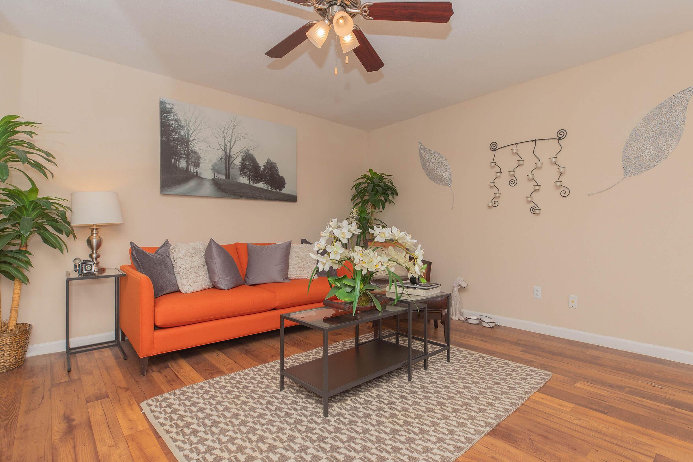 a living room filled with furniture and a table