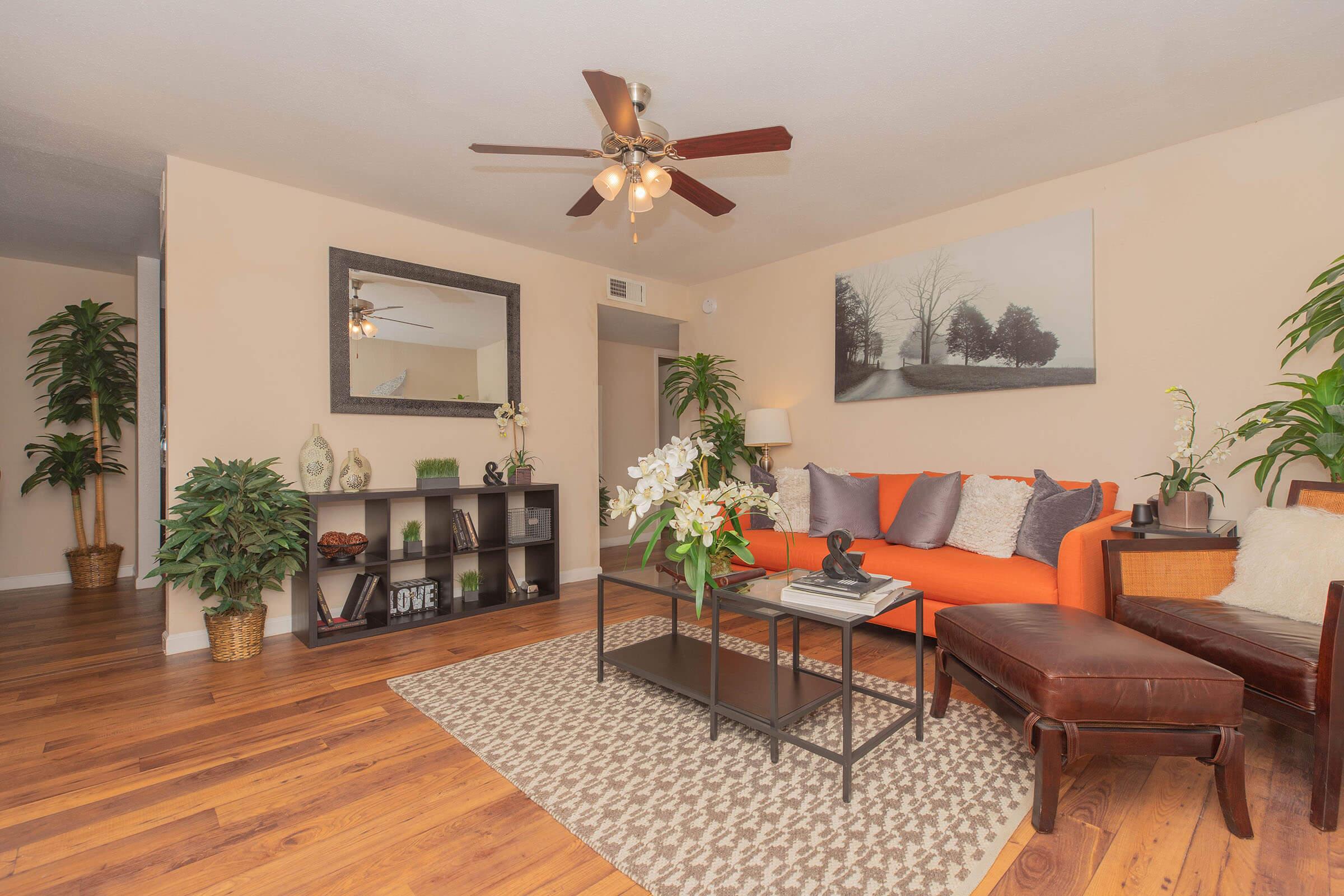 a living room filled with furniture and a fireplace