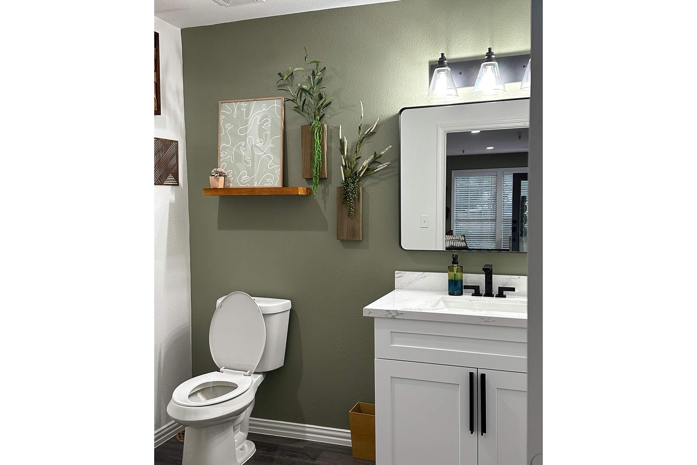 a kitchen with a sink and a mirror