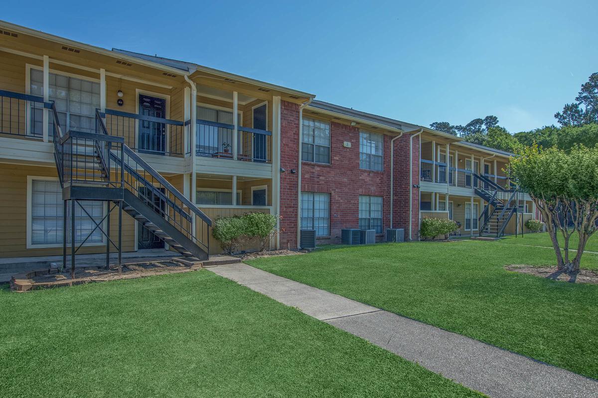 a large lawn in front of a building