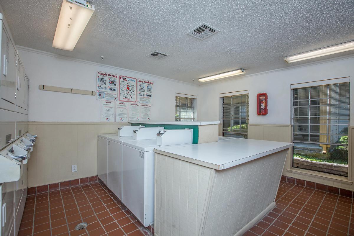 a kitchen with a tile floor